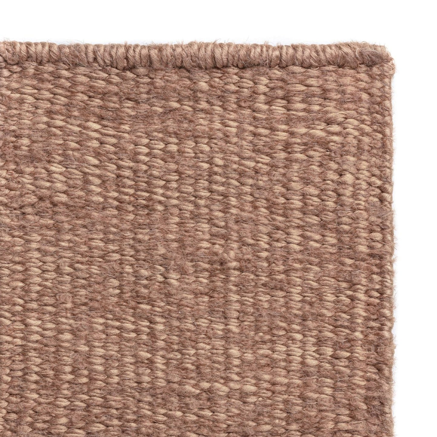 Luce rug style in palest terra cotta colored mottled twisted flat weave
