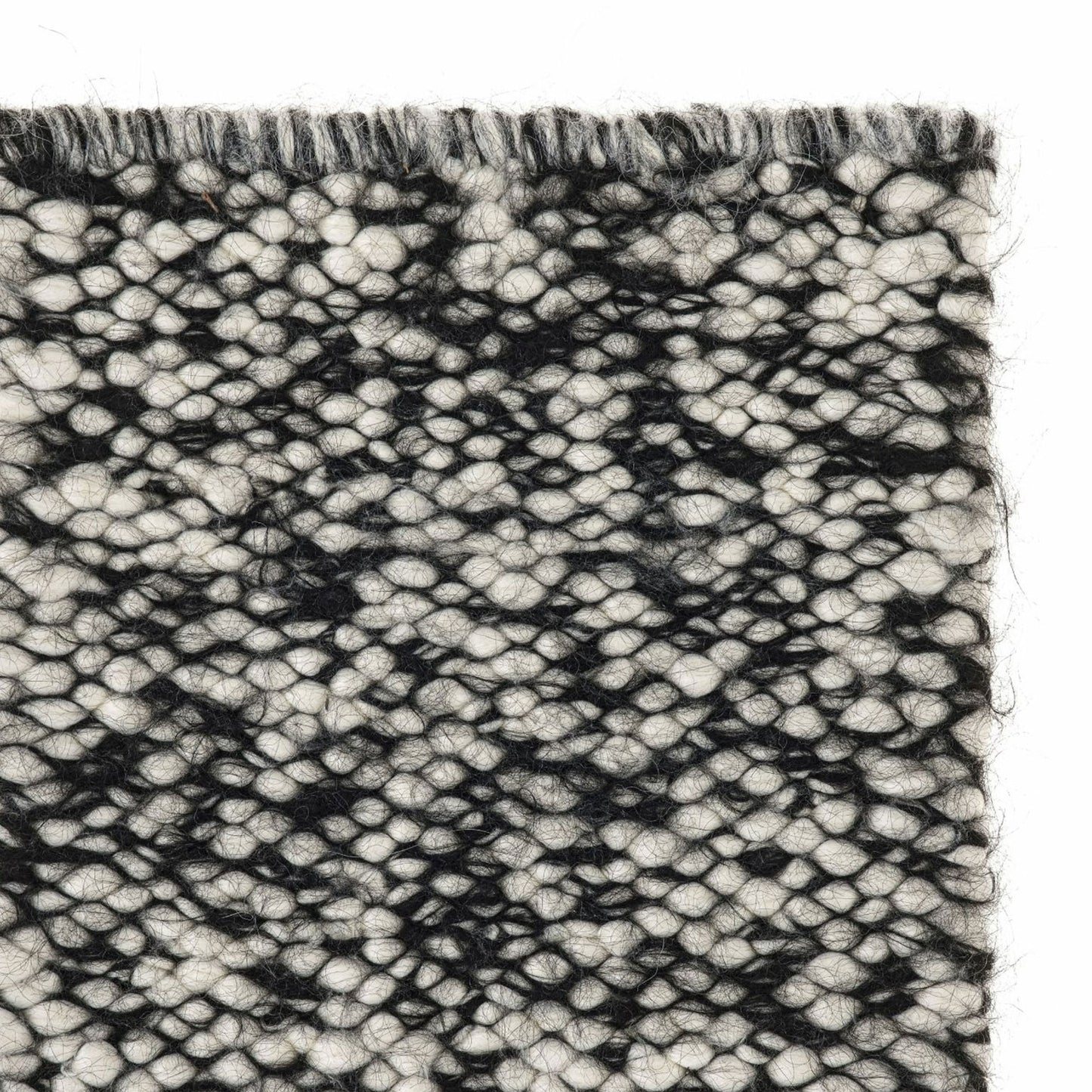 Neve rug style in cream and black colored mottled heavy flat weave