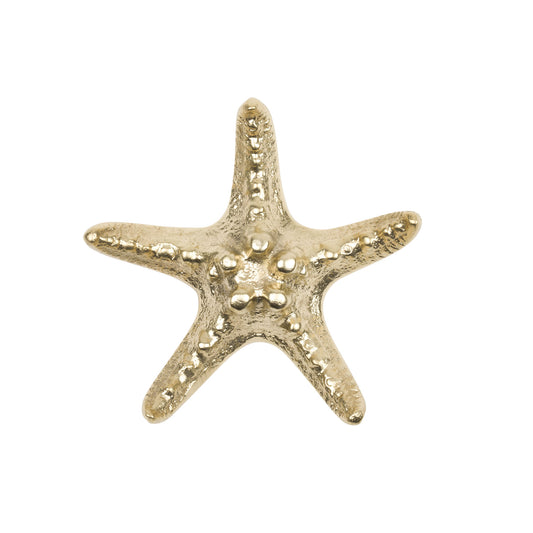 a Naturalistic brass starfish cabinet pull on a white background