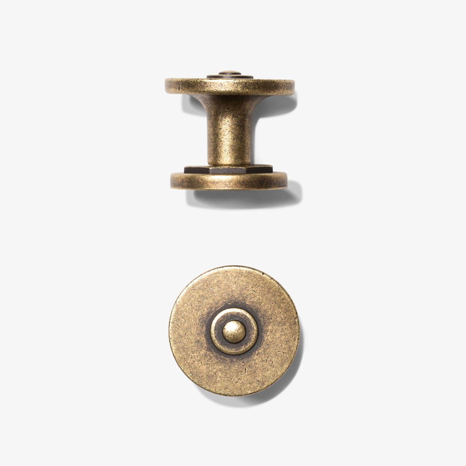 Close up and side image of the texture and color finish of the Studio Marchant Industrial modern cabinet knob.