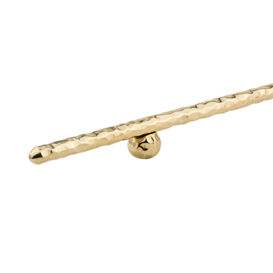 close up of Brass hand-hammered cabinet handle on a white background