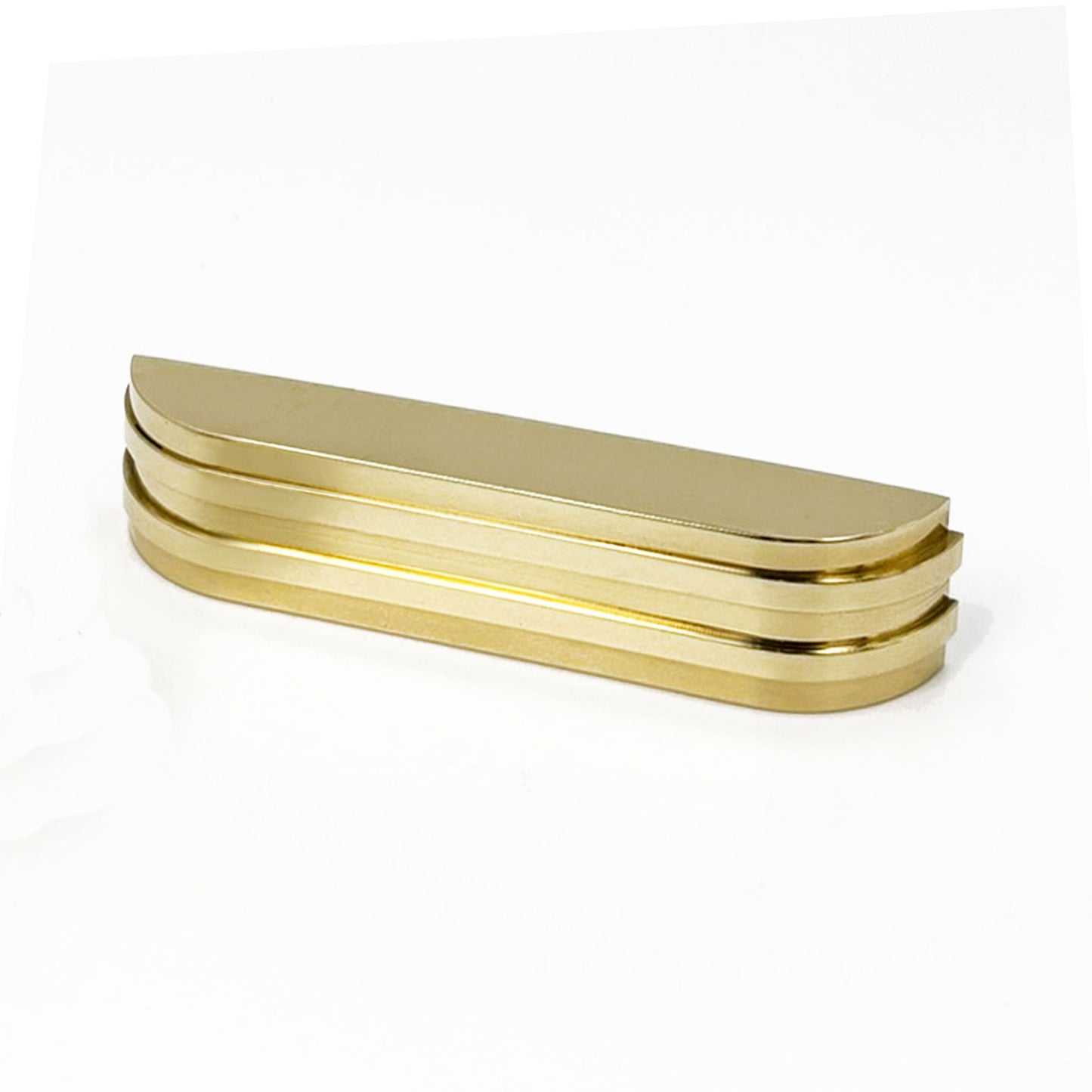 a ribbed brass metal bar cup pull  facing front next to a small brass pull turned with the grip side facing  us on a white background