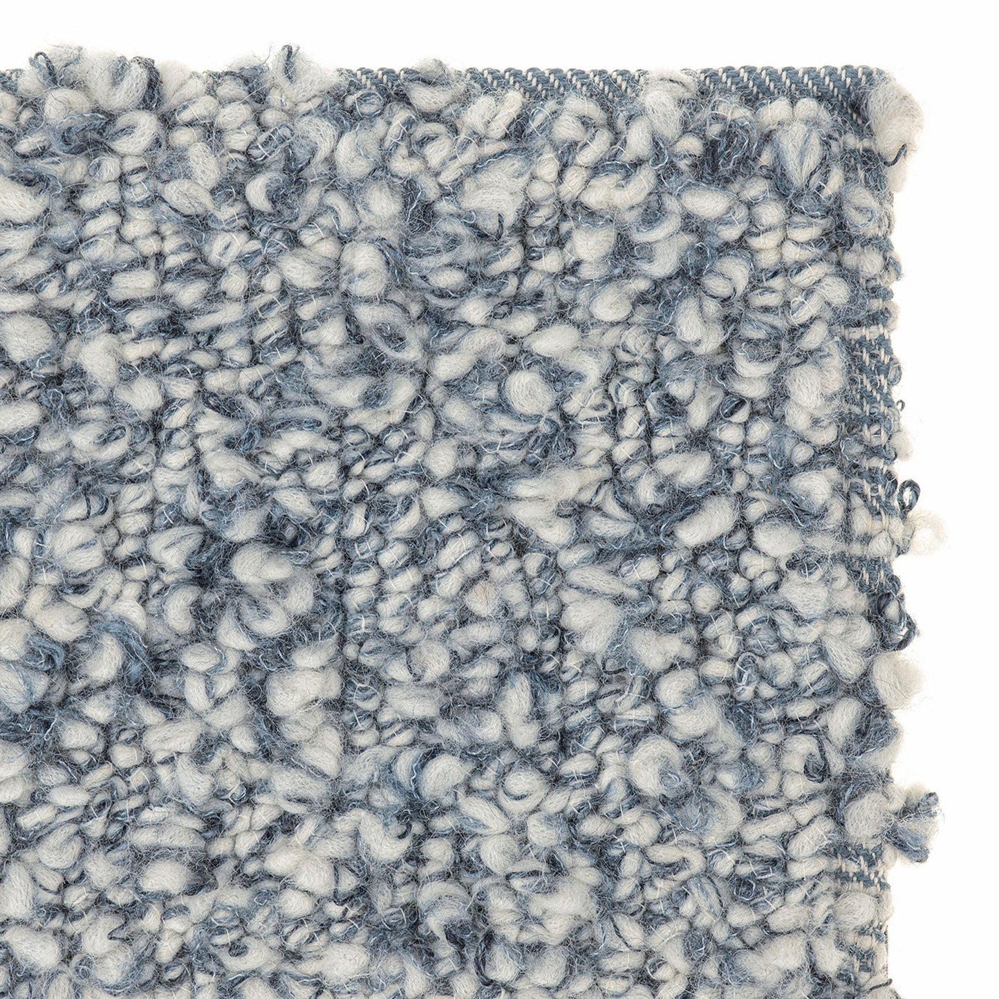 Aria rug style in smoke blue and cream colored twisted textured heavy boucle weave