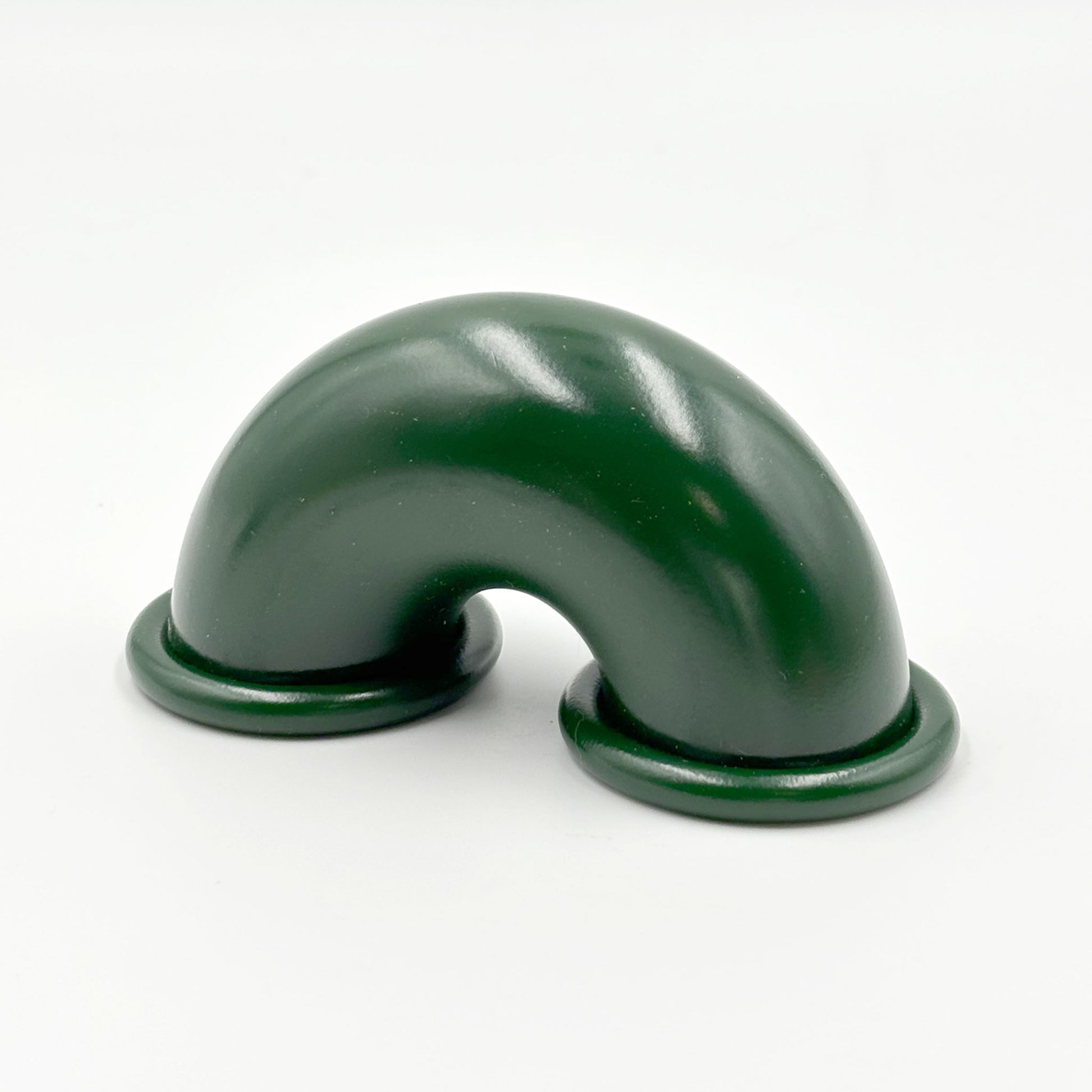Dark Green colored macaroni-shaped handles on a white background