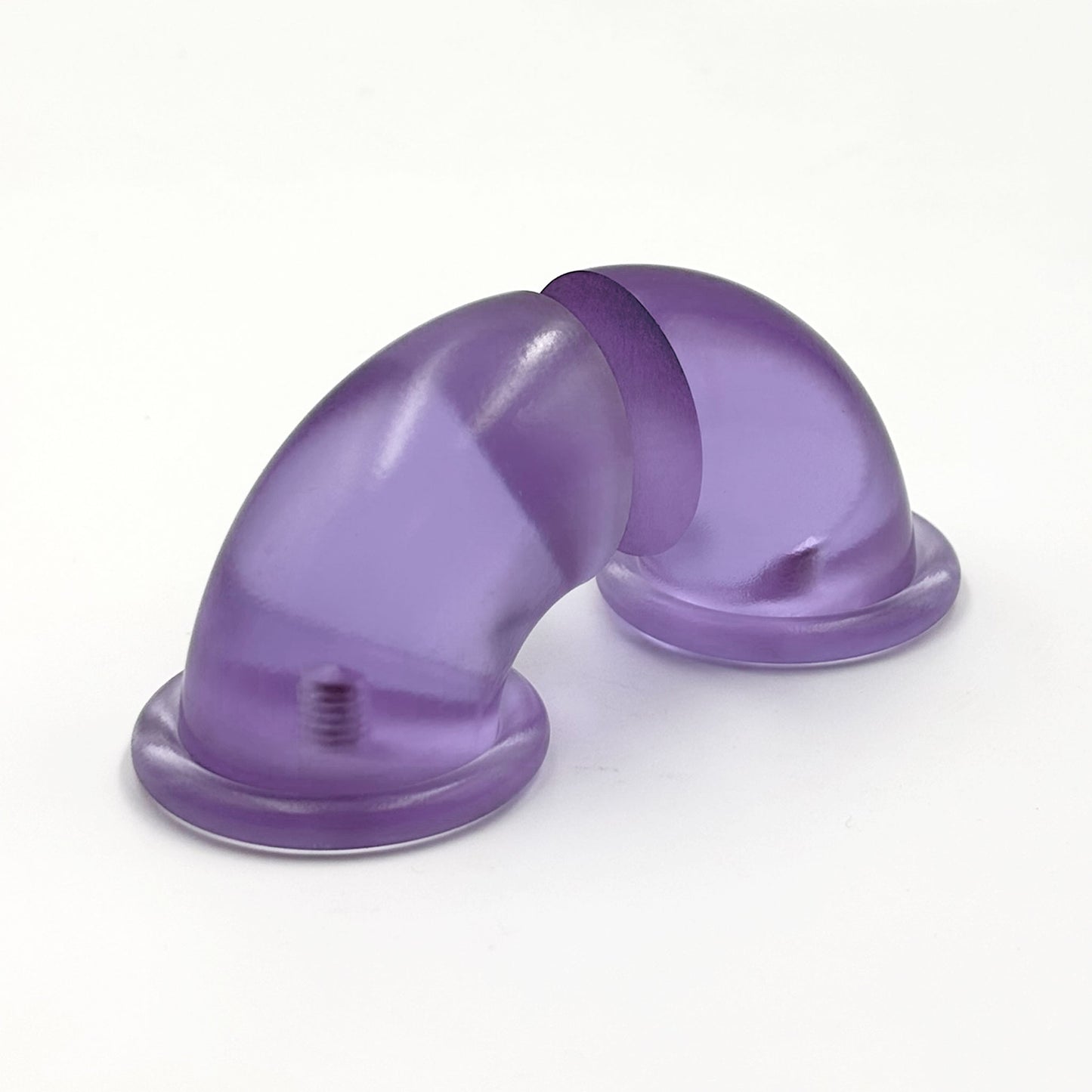 Translucent purple colored macaroni-half shaped handles on a white background