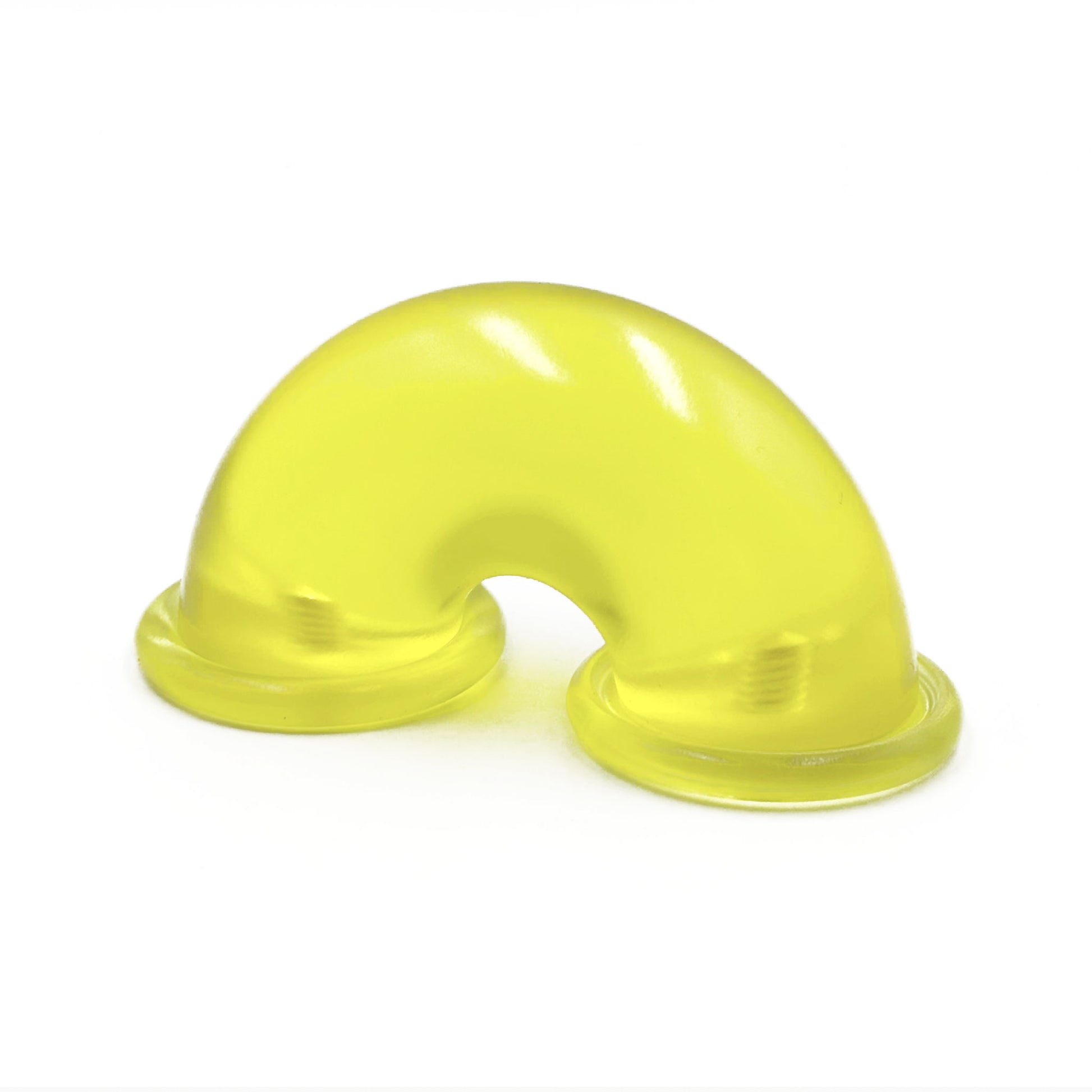 Translucent yellow colored macaroni-shaped handles on a white background