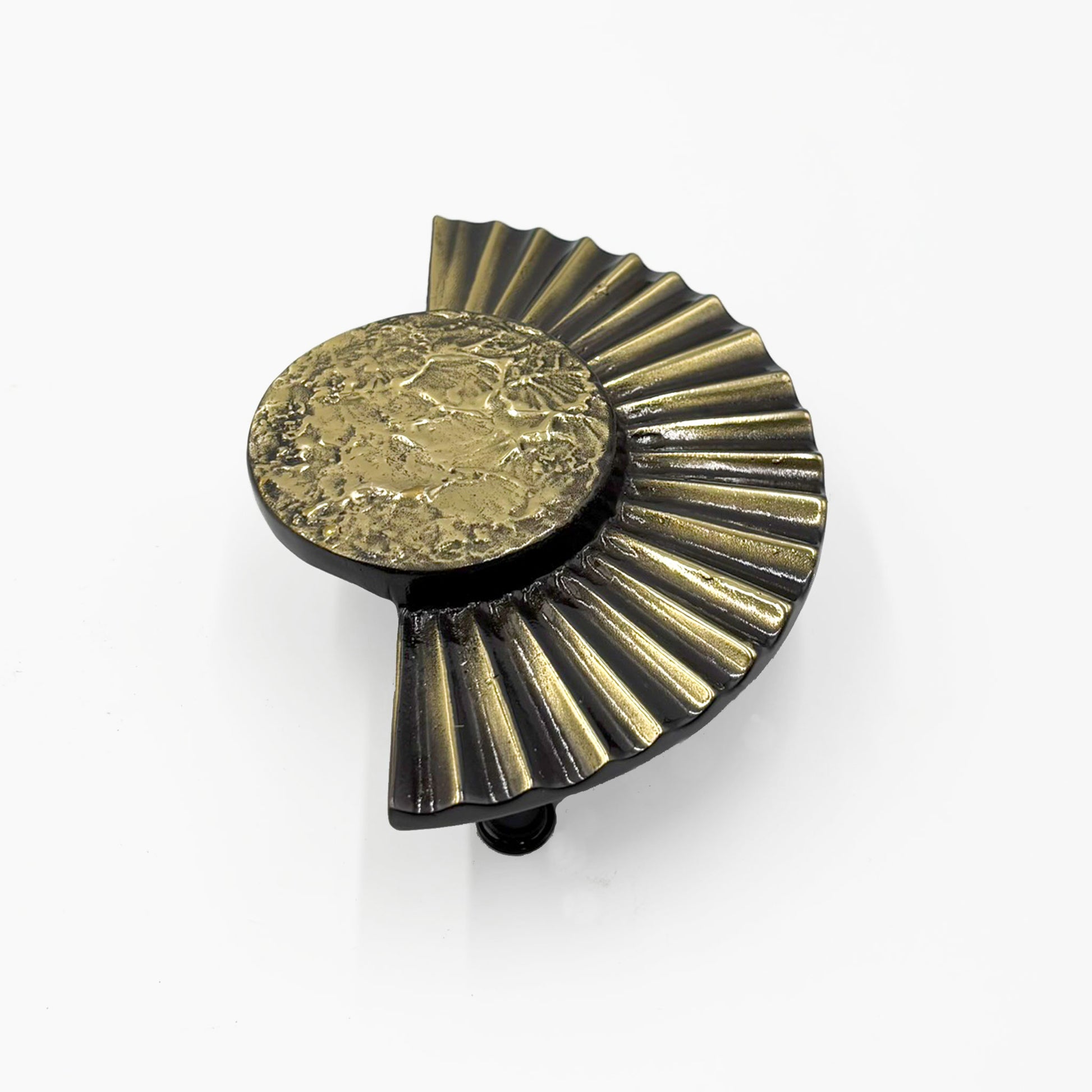 A brass cabinet pull handles designed with a sun motif, featuring a circular design with rayed edges-on a white background.