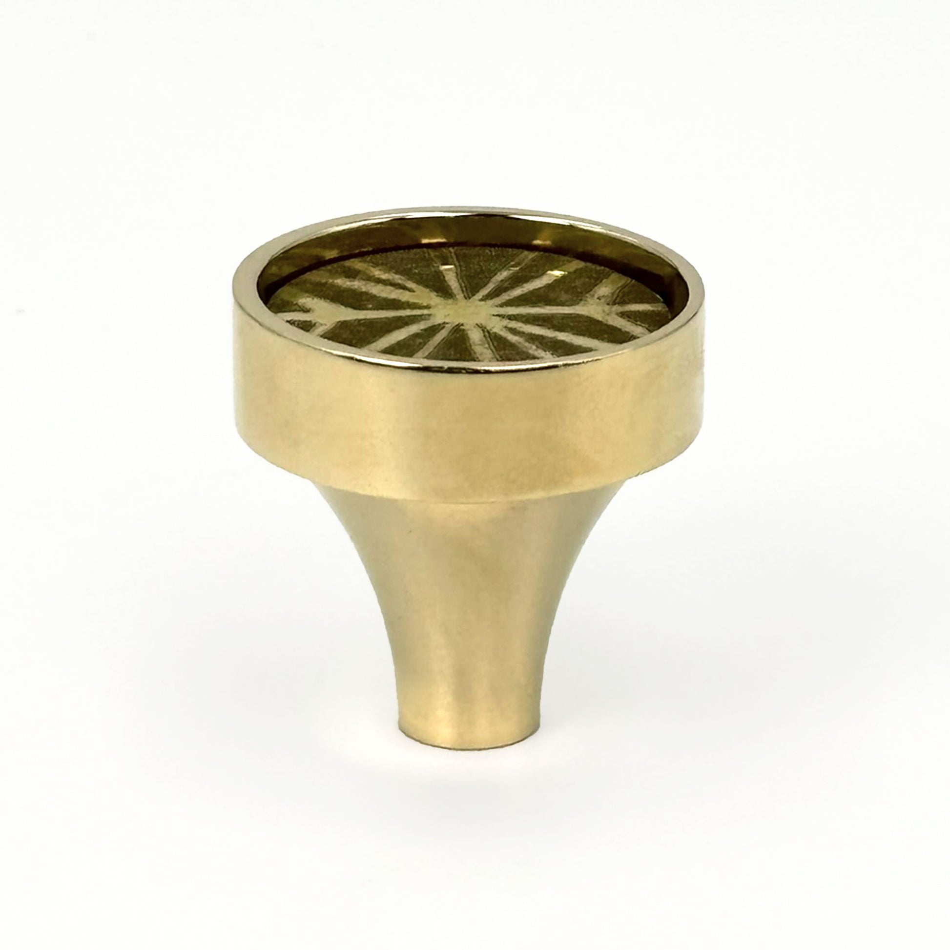 Patterned Aurora round cabinet pull with etched lines on a white background