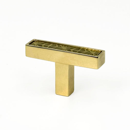 Unlacquered Brass cabinet T-[ull handle with geometric design on a white background