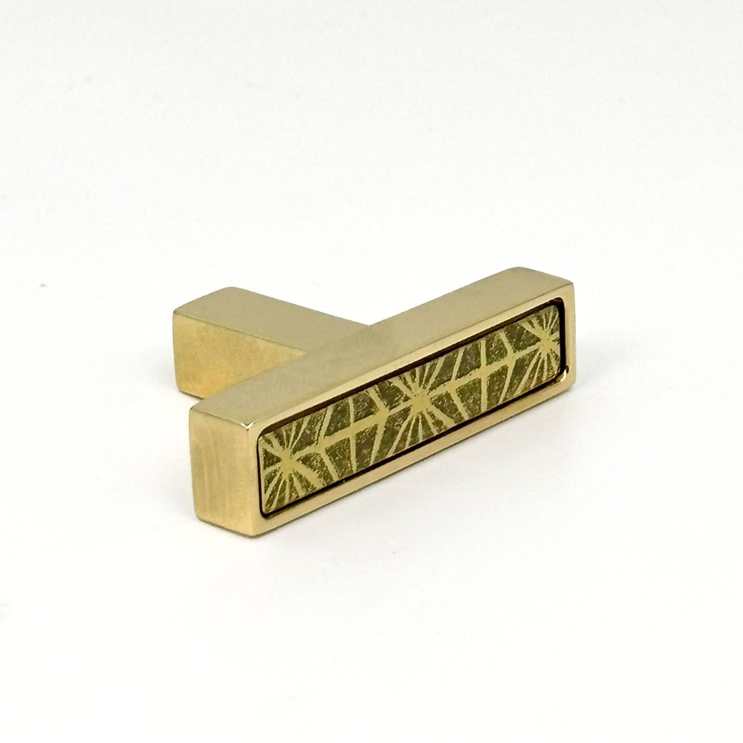 Unlacquered Brass cabinet T-[ull handle with geometric design on a white background