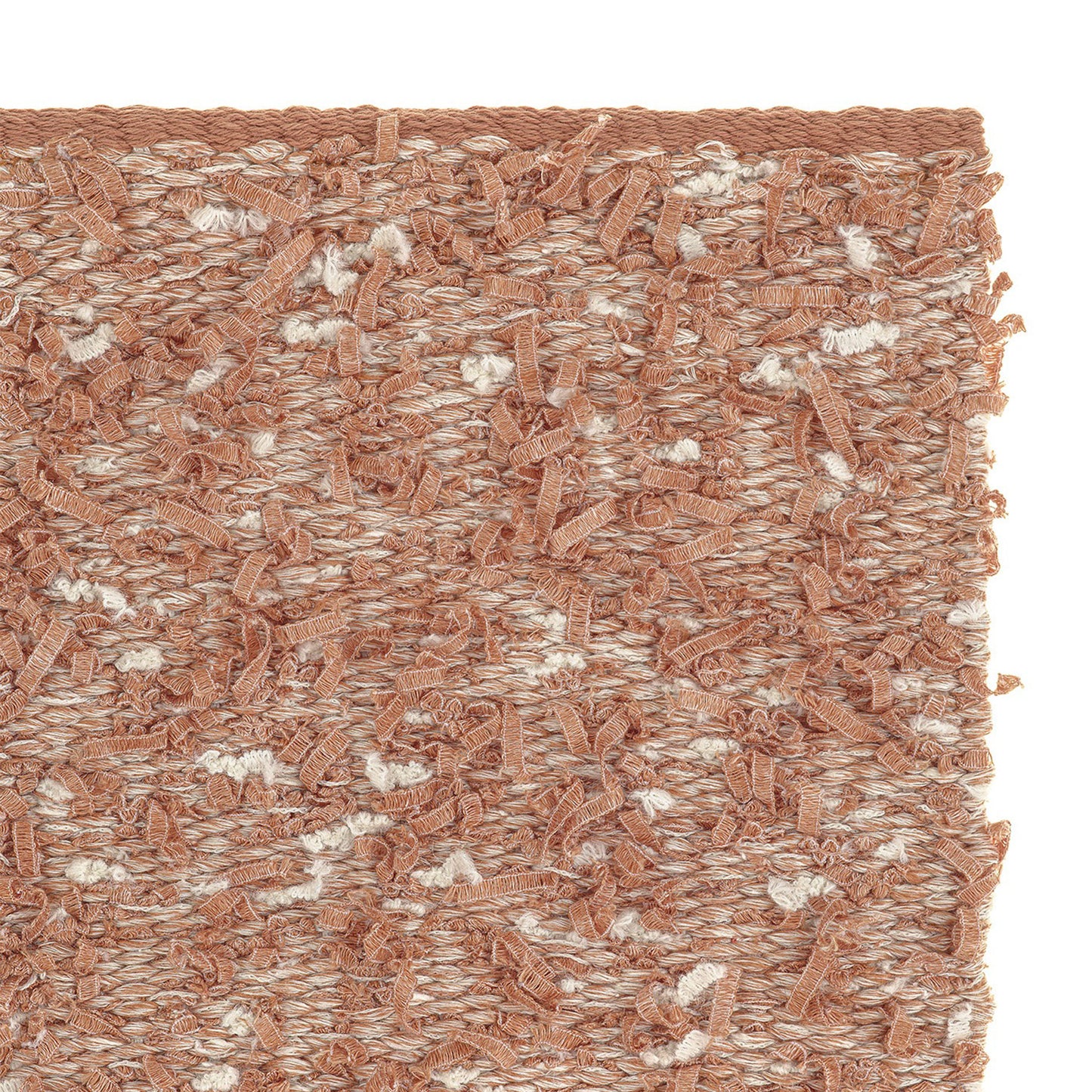 Bentu rug style in pale terra cotta colored eyelash textured flat weave