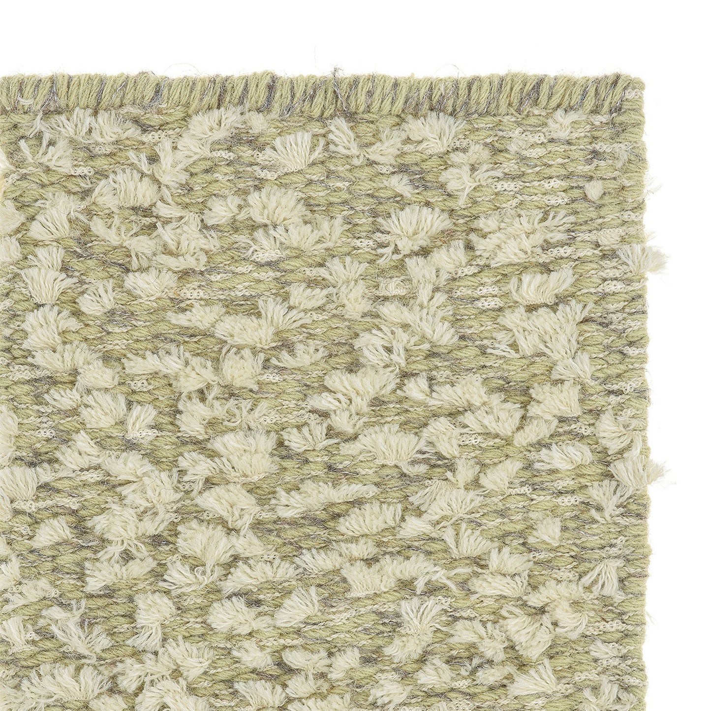 Cardu rug style in buff and celadon colored tufted flat weave