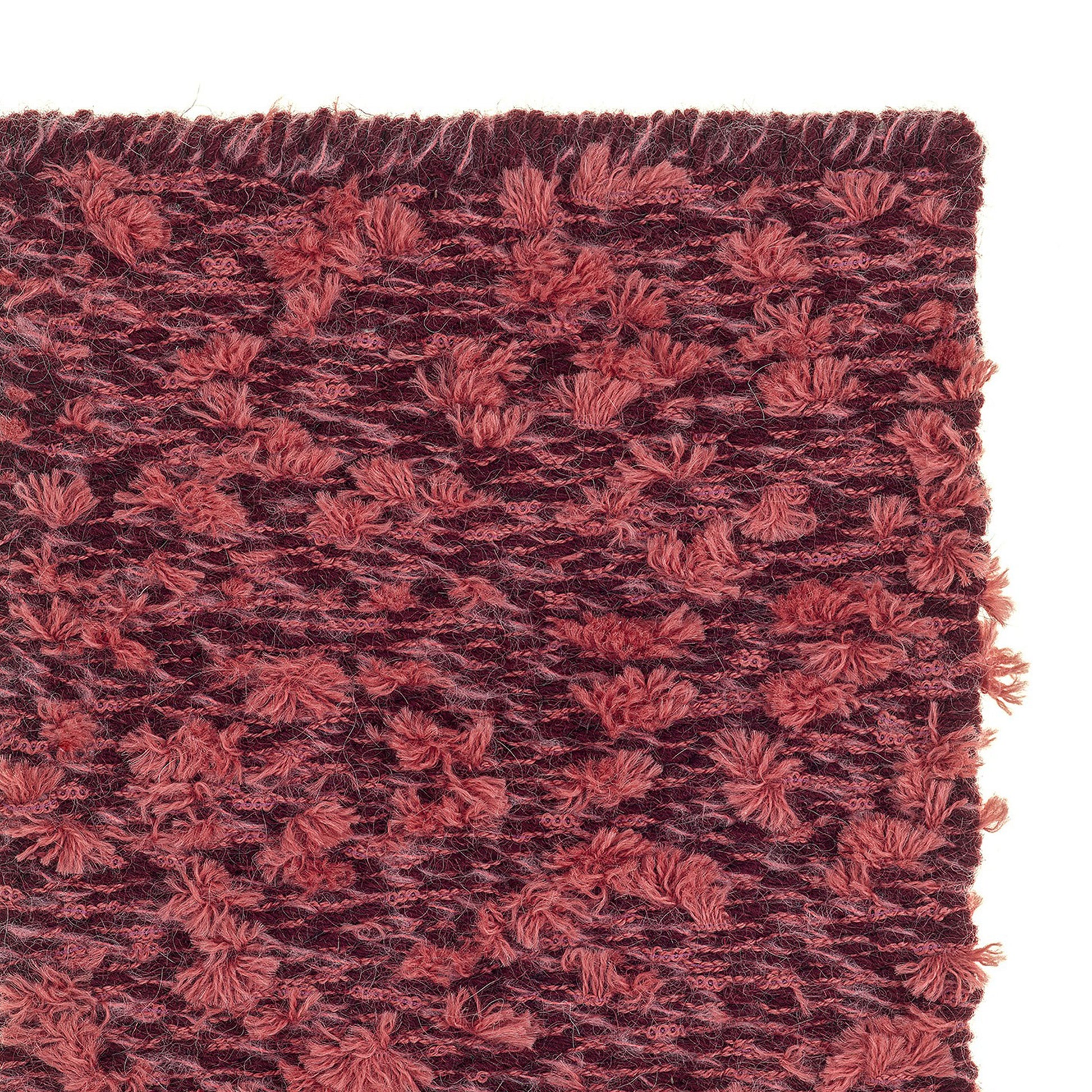 Cardu rug style in terra cotta and garnet colored tufted flat weave