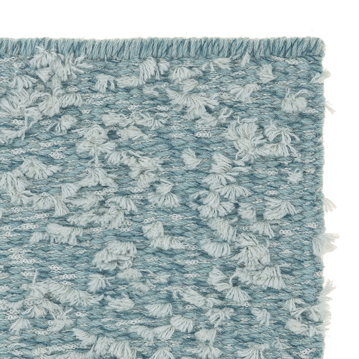 Cardu rug style in mixed pale blue colored tufted flat weave