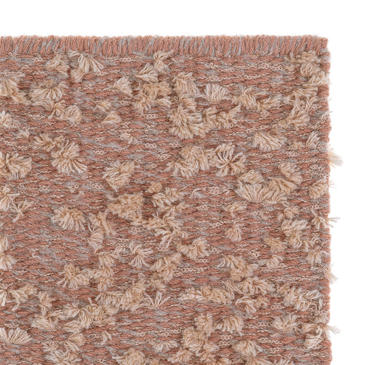 Cardu rug style in terra cotta and peach colored tufted flat weave