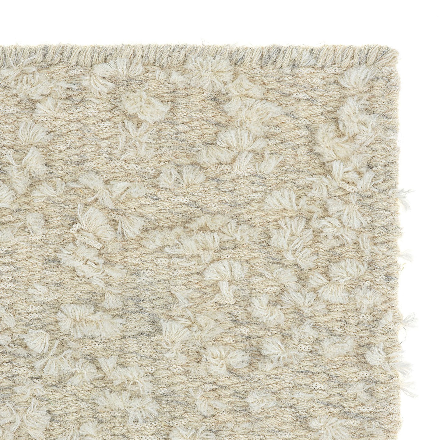 Cardu rug style in buff and buff colored tufted flat weave