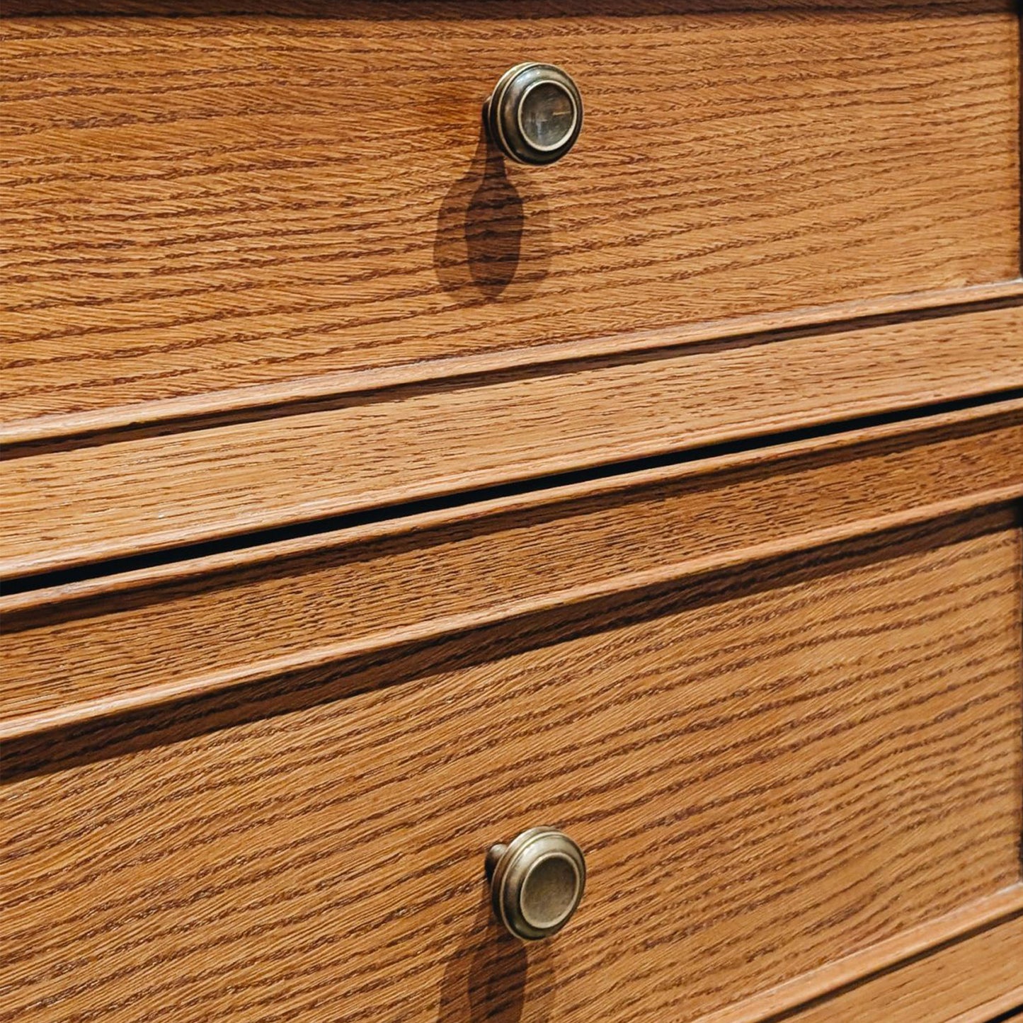 Close-up of wooden drawers with ANtique silver finished cabinet knobs