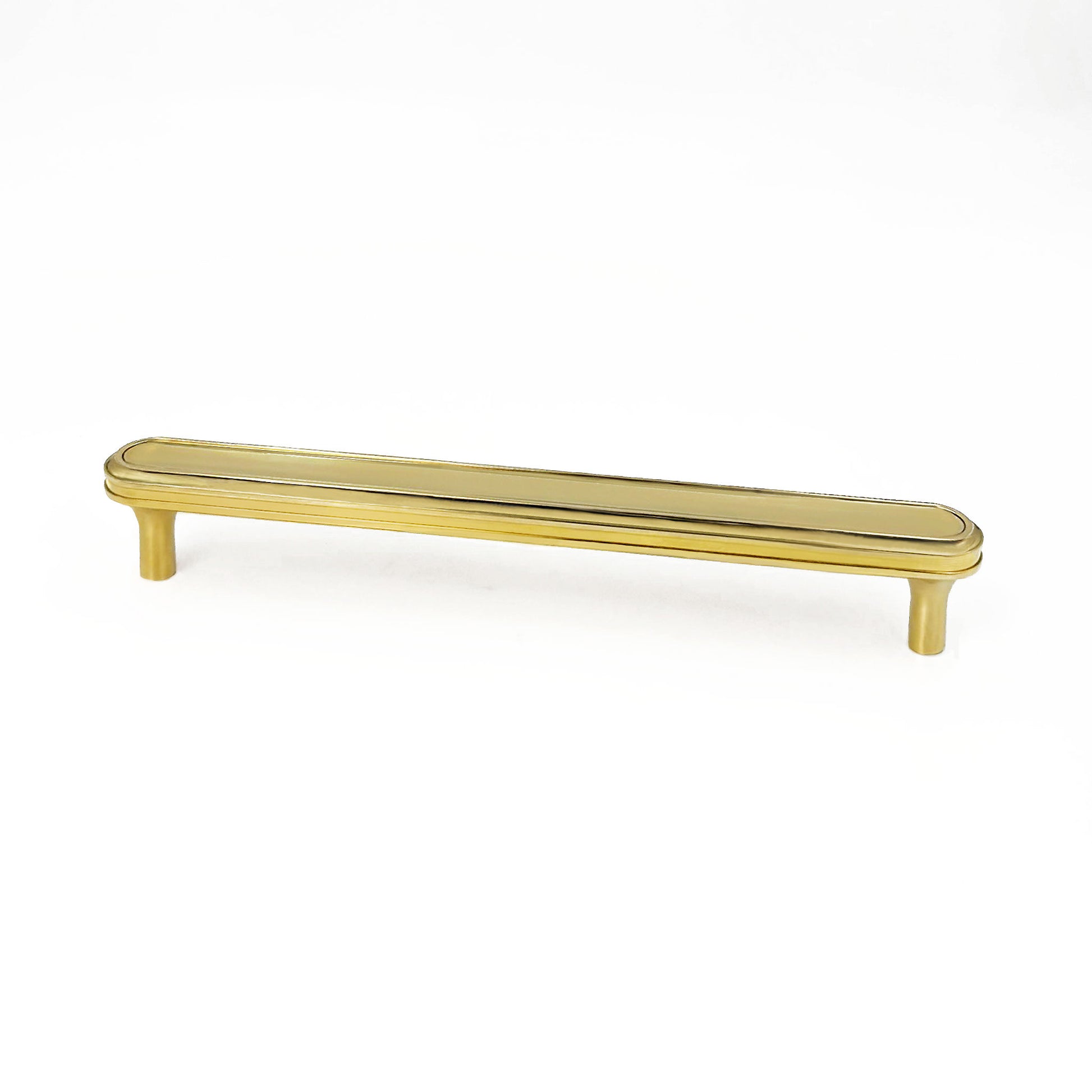 unlacquered brass collection turned cabinet handle on a white backgroun