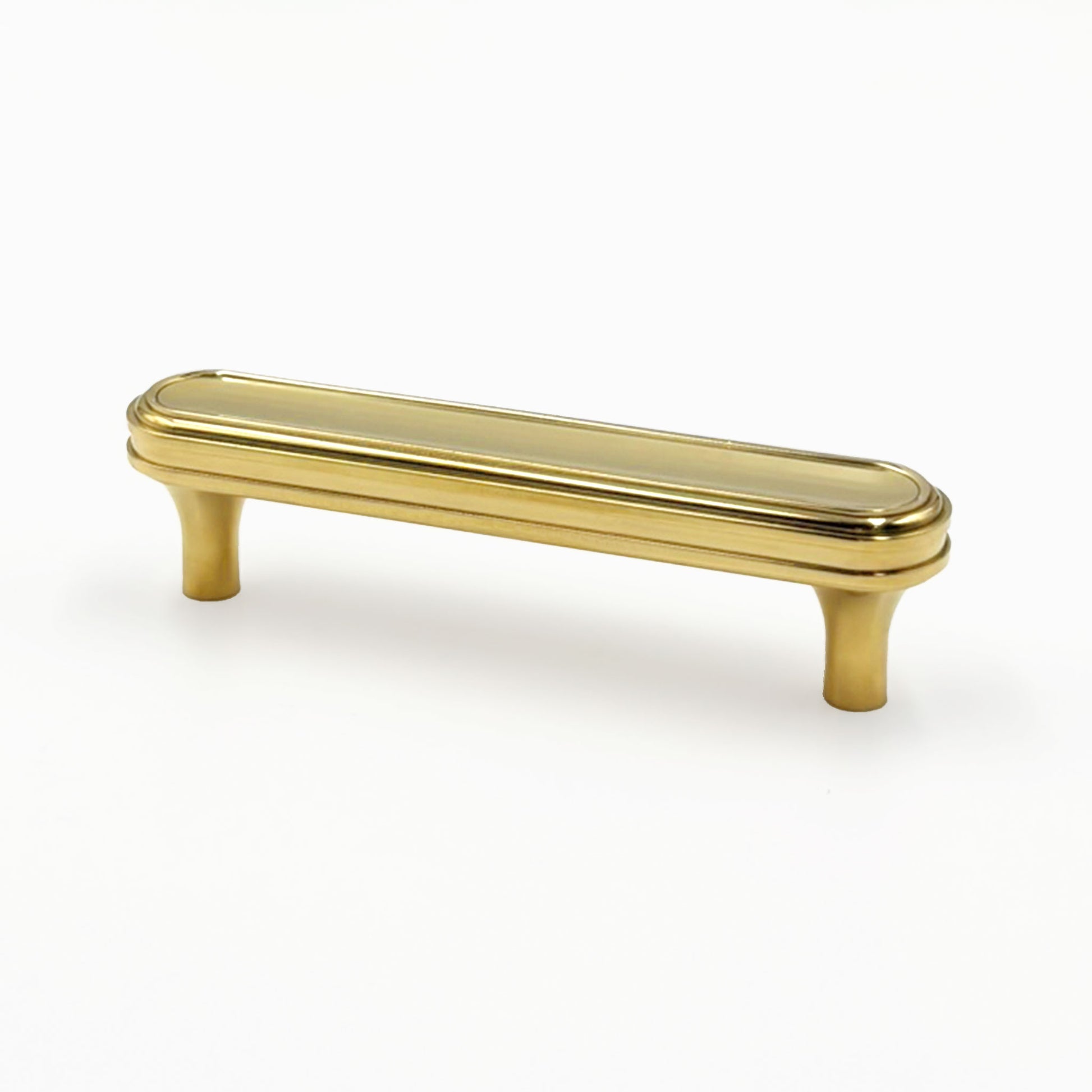 unlacquered brass turned cabinet handles on a white 