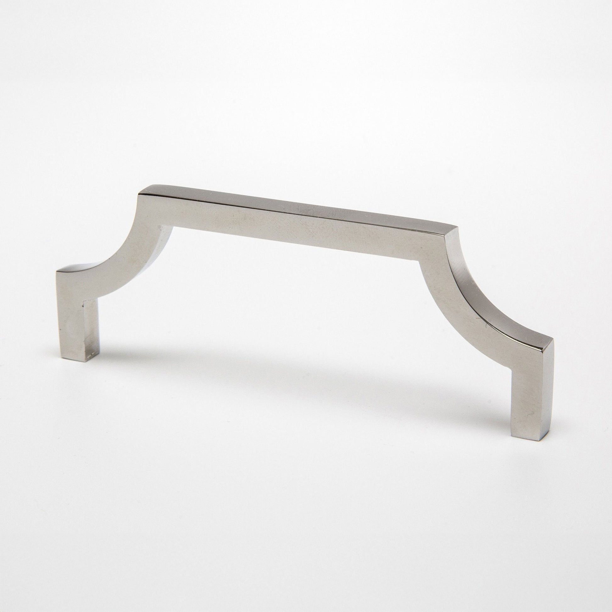 A polished nickel cabinet pull handle with a curved corner design on a clean white background.