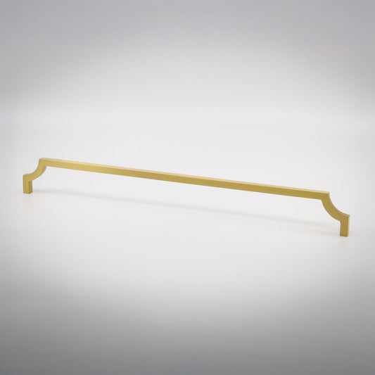 A long, slender cabinet pull handle with decorative scrolled ends, finished in a matte brass, shown on a clean light gray background.