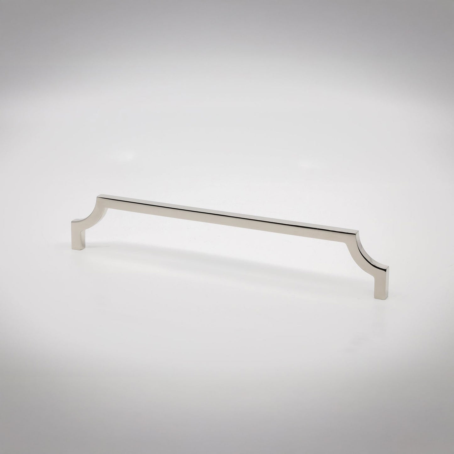 A polished nickel cabinet pull handle with decorative scrolled ends, shown on a clean light gray background.