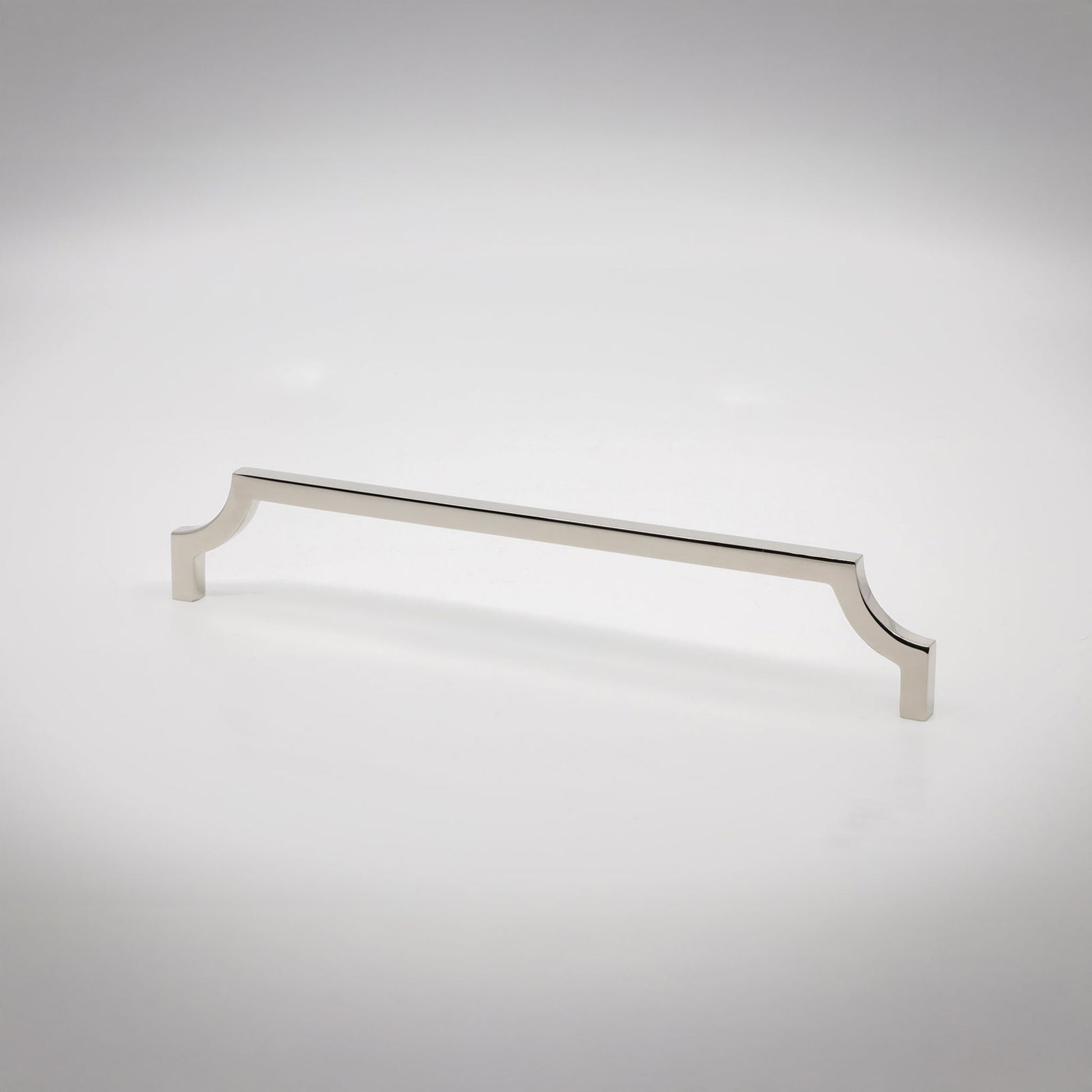 A polished nickel cabinet pull handle with decorative scrolled ends, shown on a clean light gray background.