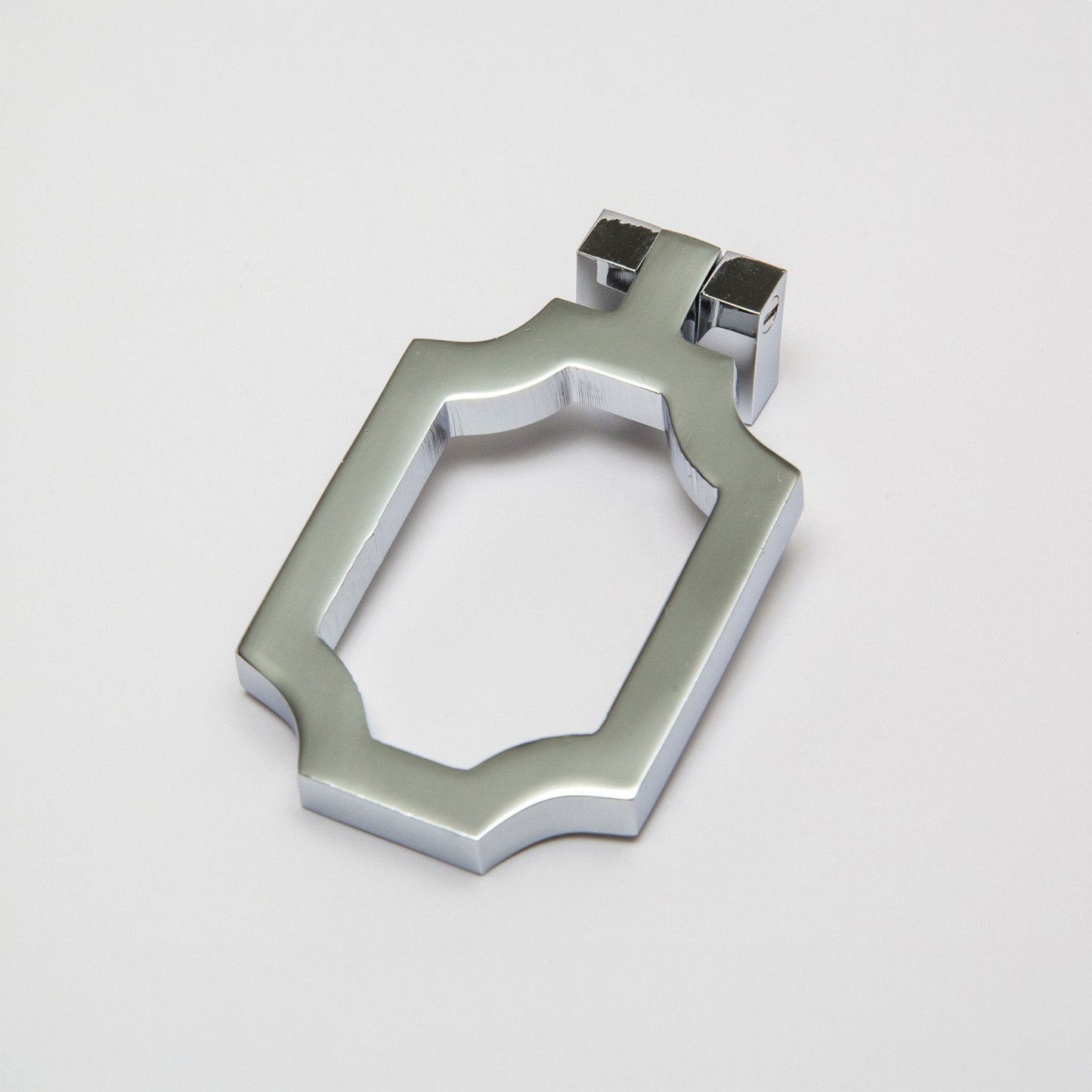 A small curved corners cabinet pull finished in a polished chrome, shown on a clean light gray background.