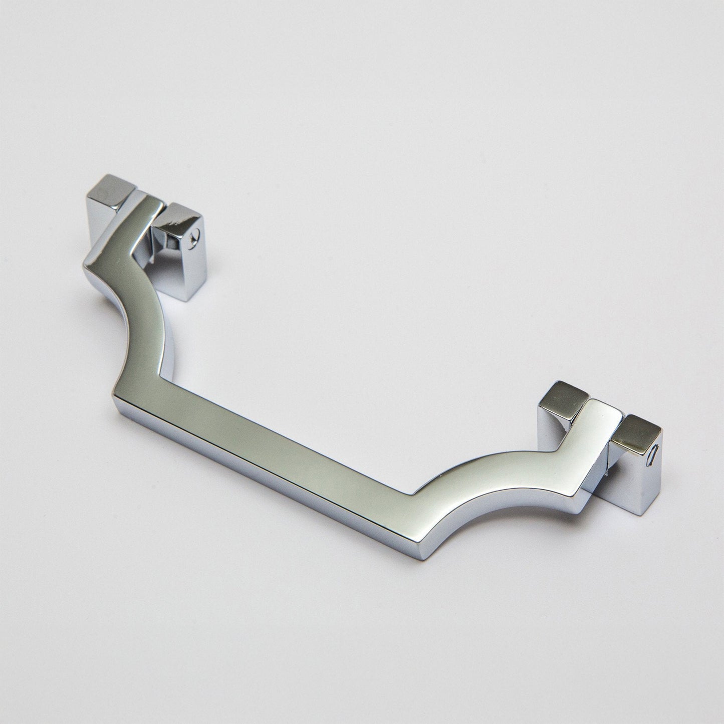 A modern curved bar handle drop pull in a polished chrome finish, shown on a light gray background.