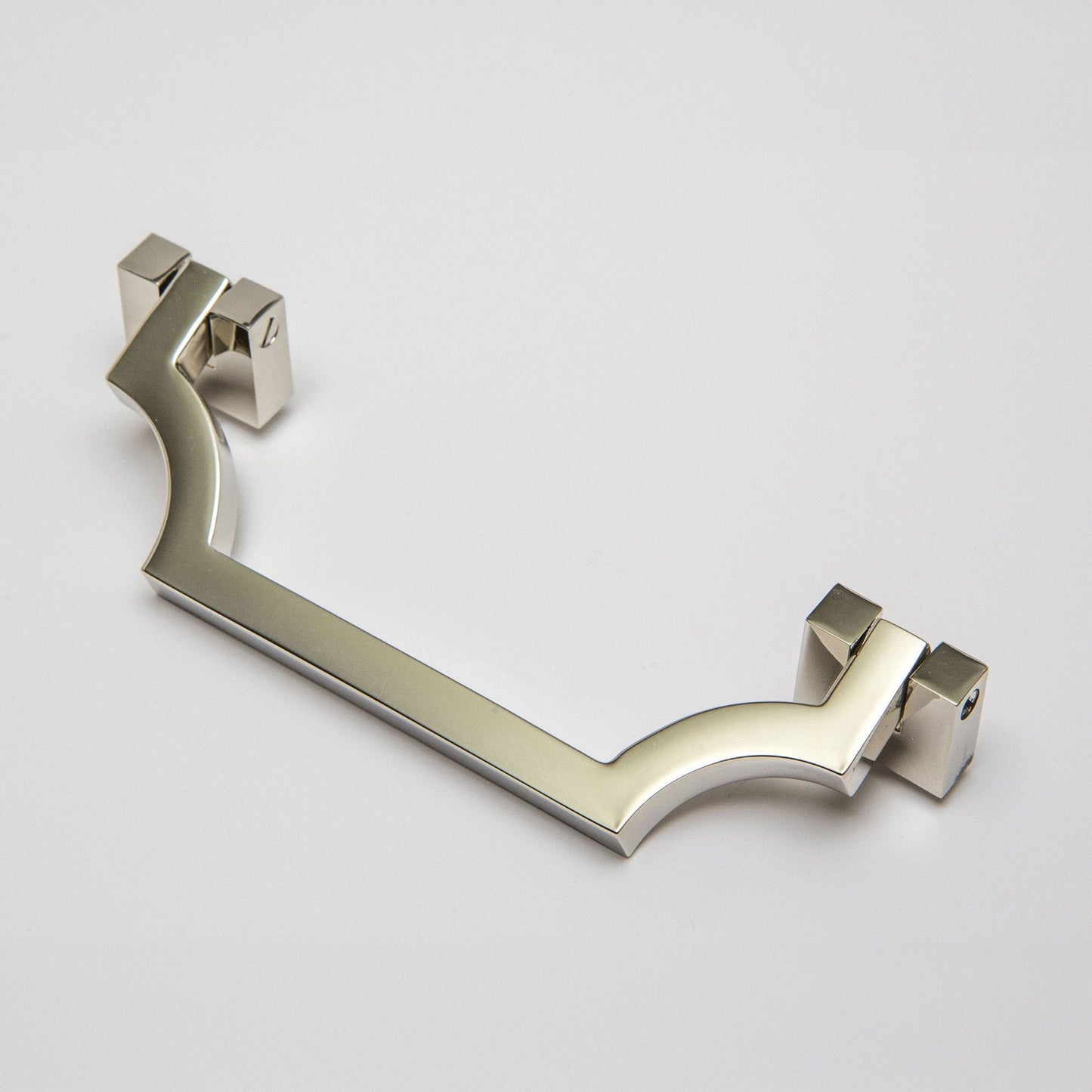 A modern curved bar handle drop pull in a brushed polished nickel finish, shown on a light gray background.