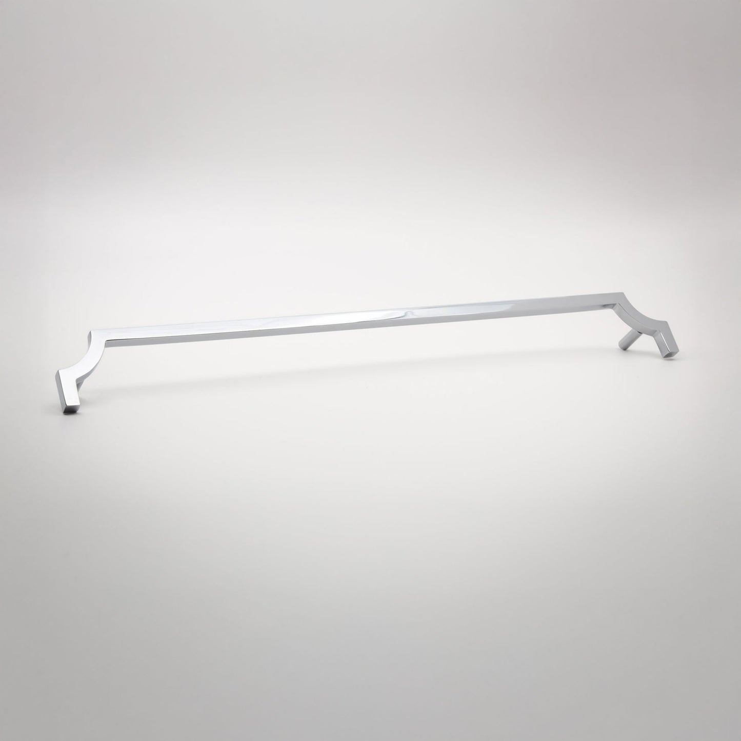 A long, slender cabinet pull in a polished chrome finish shown against a neutral background.