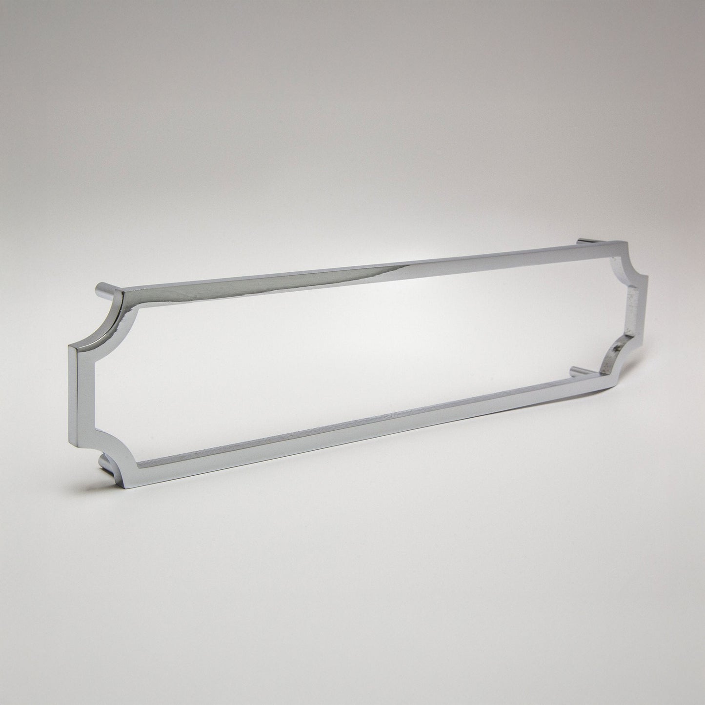 A long polished chrome cabinet pull with curved ends, shown on a light gray gradient background.
