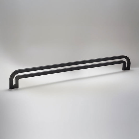 Arch shaped linear cabinet pull with cut our internal area on a grey background