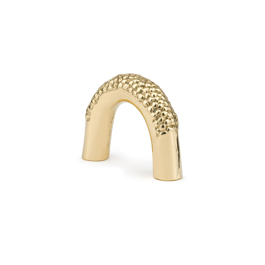 Brass textured arch cabinet pull with a chain link shape on a white background