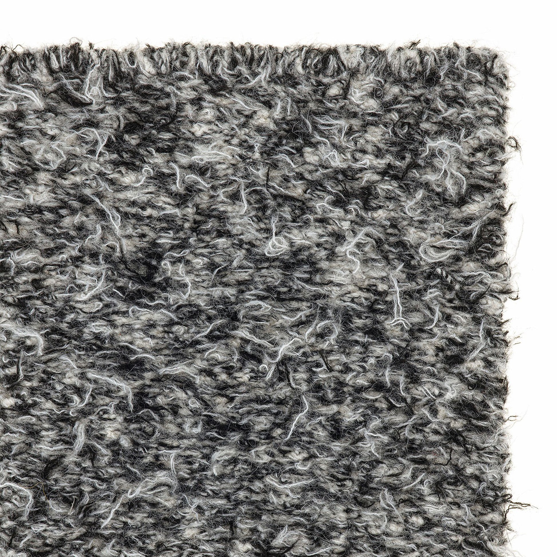 Erbe rug style in cream and black colored woven shag weave close up