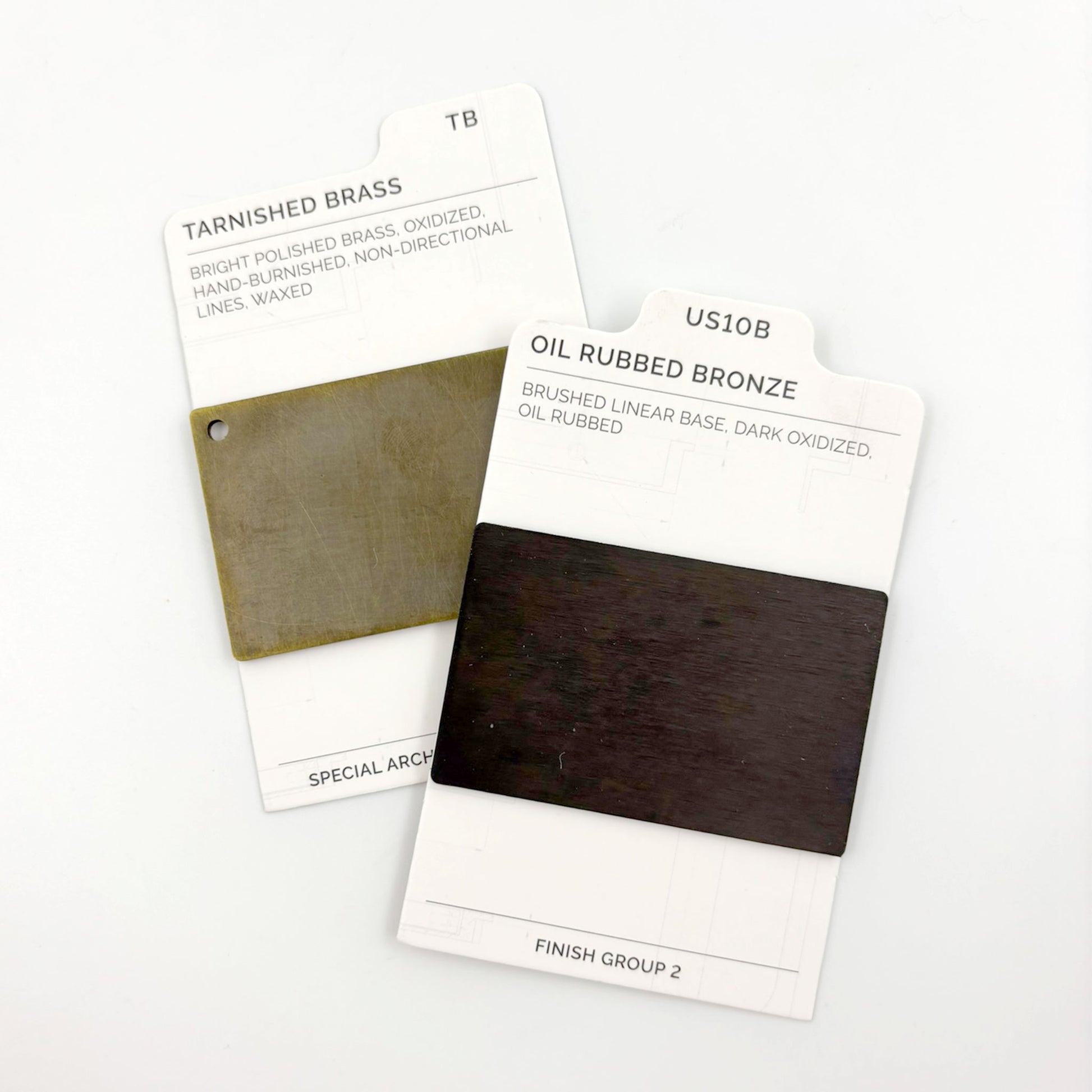 Two color swatch cards labeled 'Tarnished Brass' and 'Oil Rubbed Bronze' on a white background.