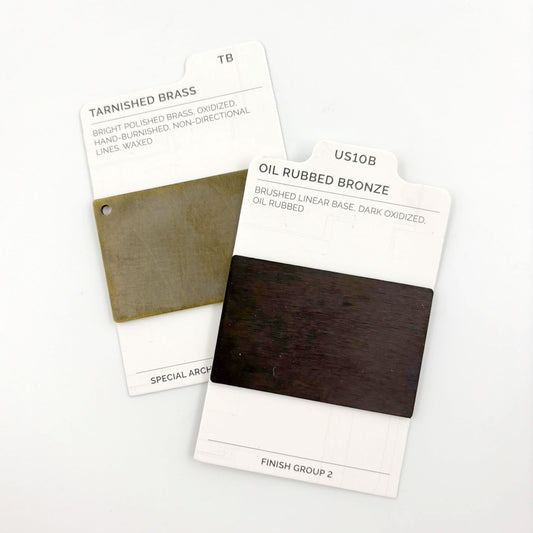 Two color swatch cards labeled 'Tarnished Brass' and 'Oil Rubbed Bronze' on a white background.