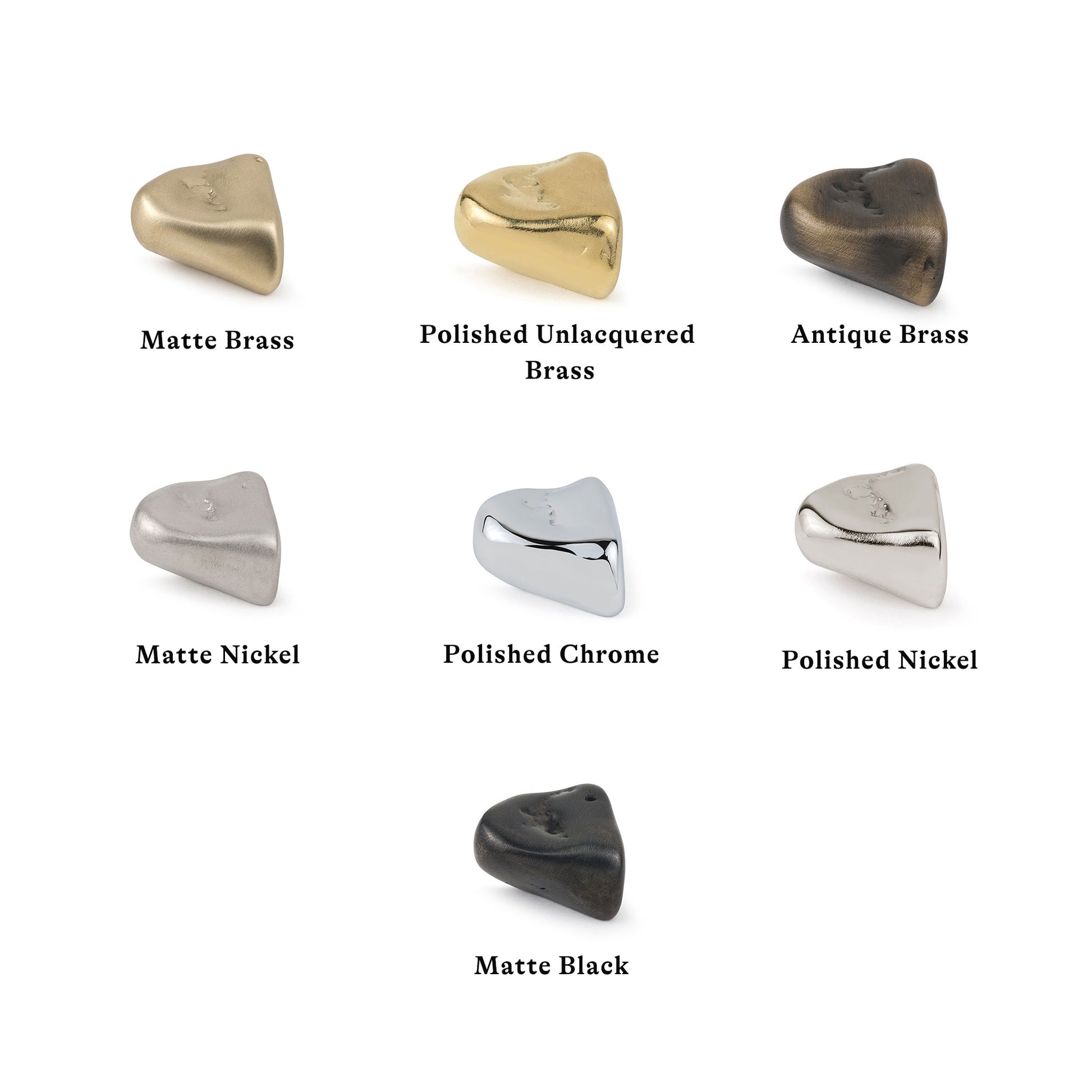 Collection of stonet-shaped metal cabinet knobs in various finishes on a white background