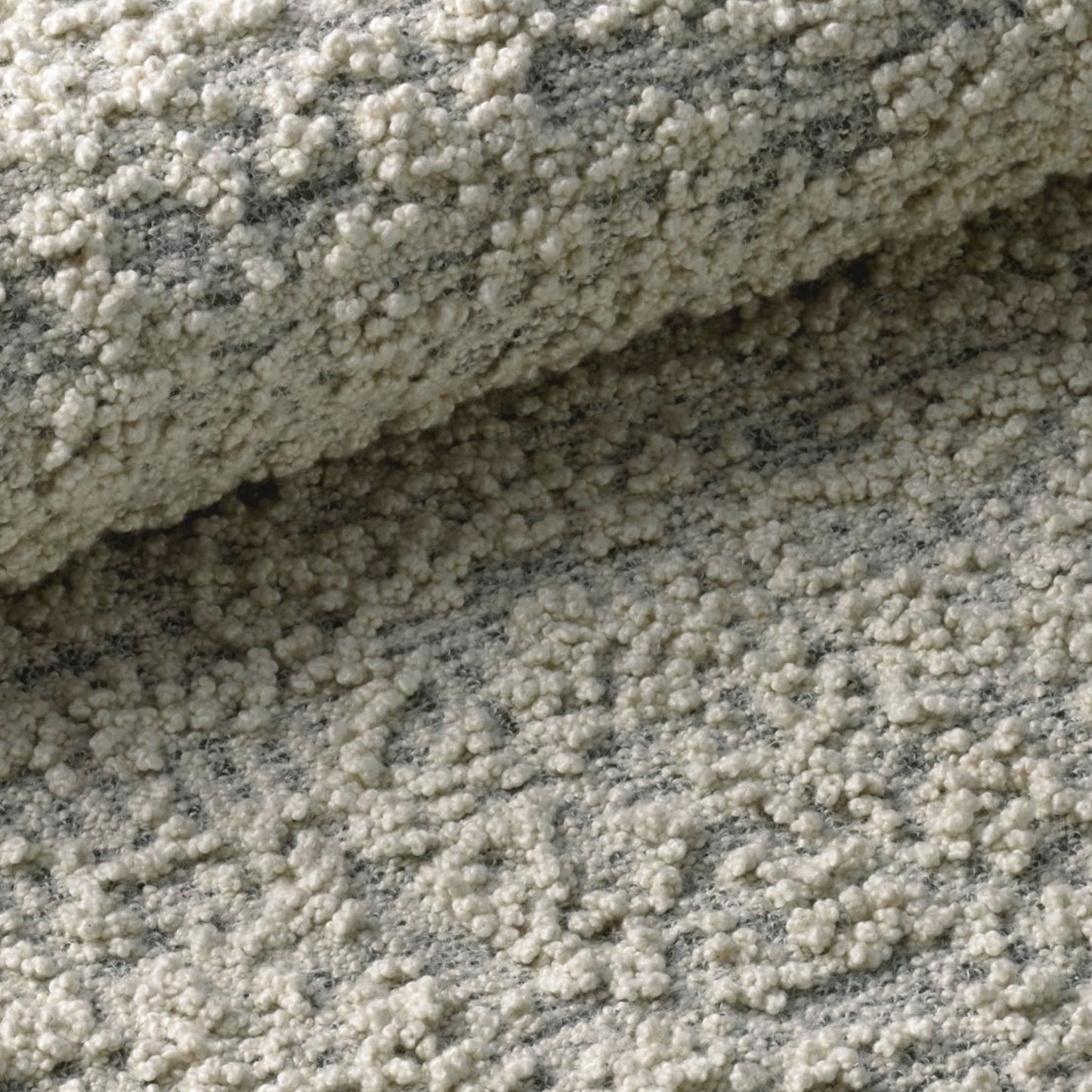 Fiore rug style in cream and medium grey colored boucle weave close up