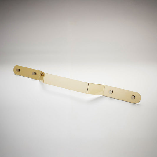 A minimalist, long, polished unlaquered brass metal cabinet pull handle with two mounting holes, shown on a white background.