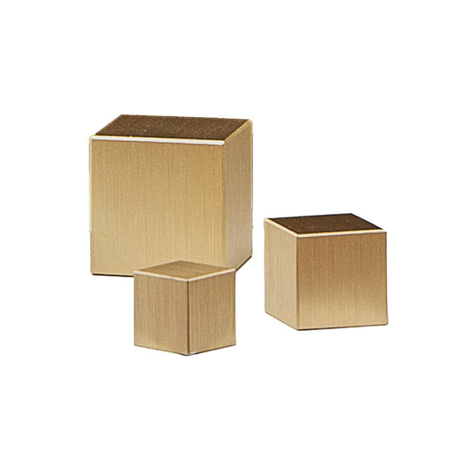 Three gold cube-shaped cabinet knobs in variant sizes