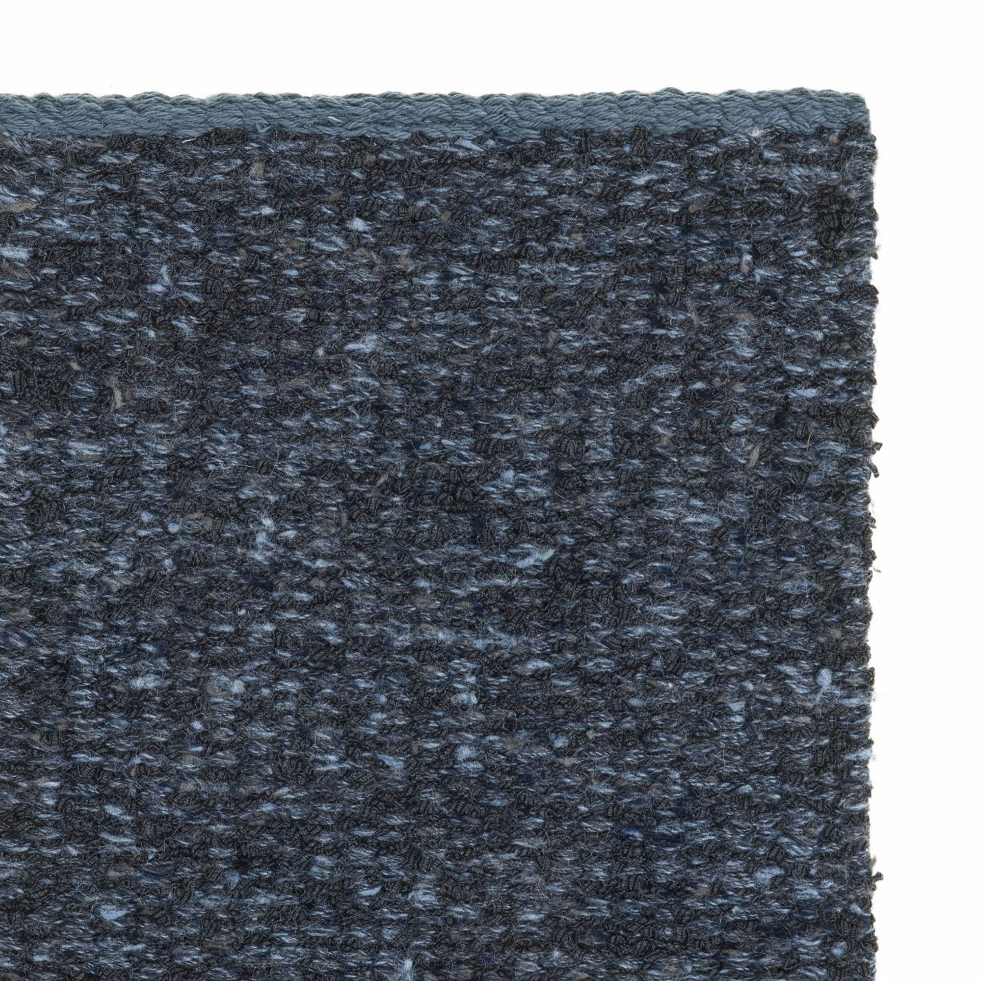 Iris rug style in black and cadet blue colored mottled twisted flat weave