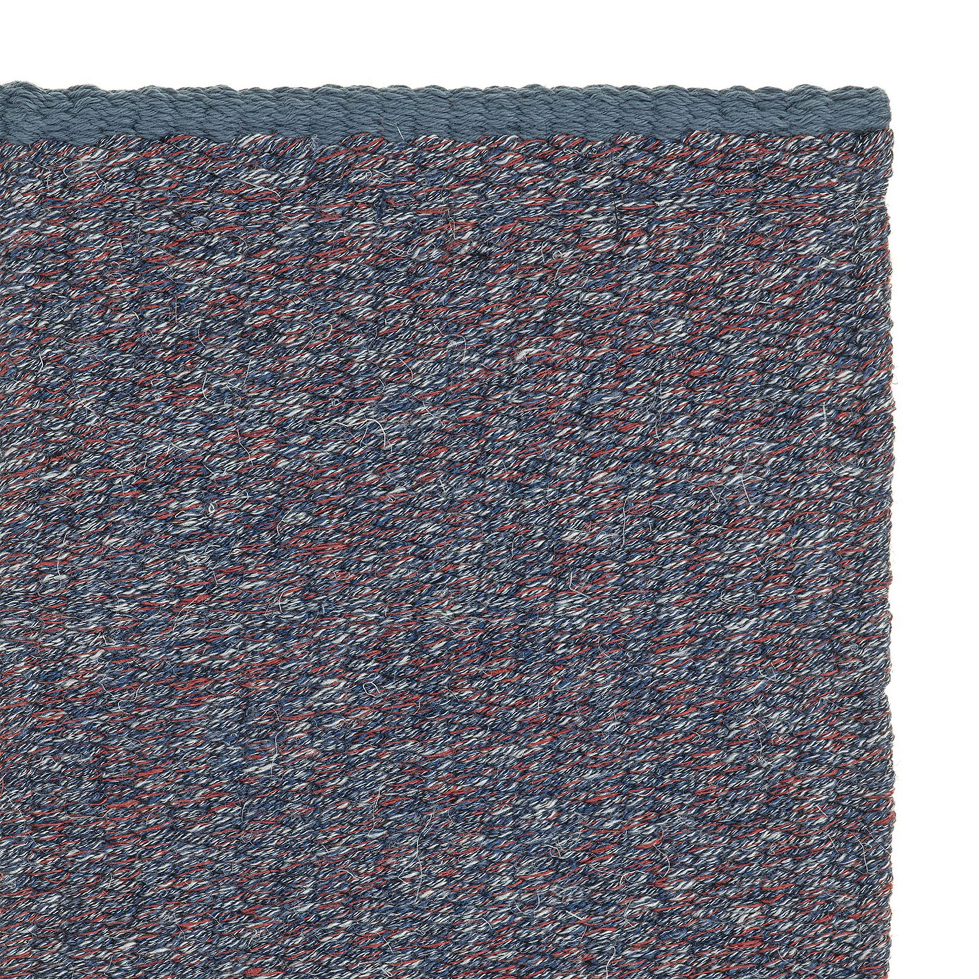 Jaspe rug style in smoke blue and deep taupe spun flat weave