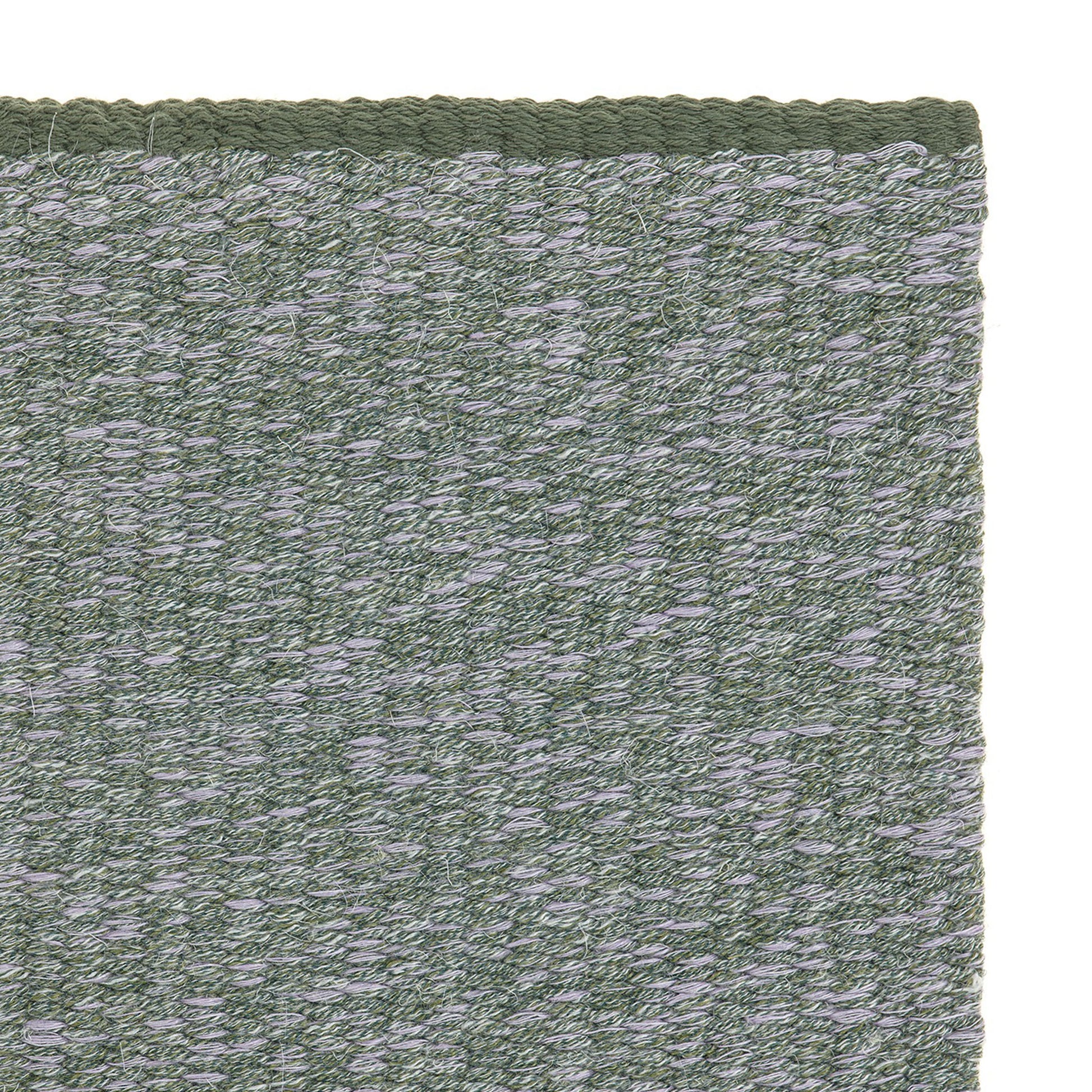 Jaspe rug style in smoke grey and grey green spun flat weave