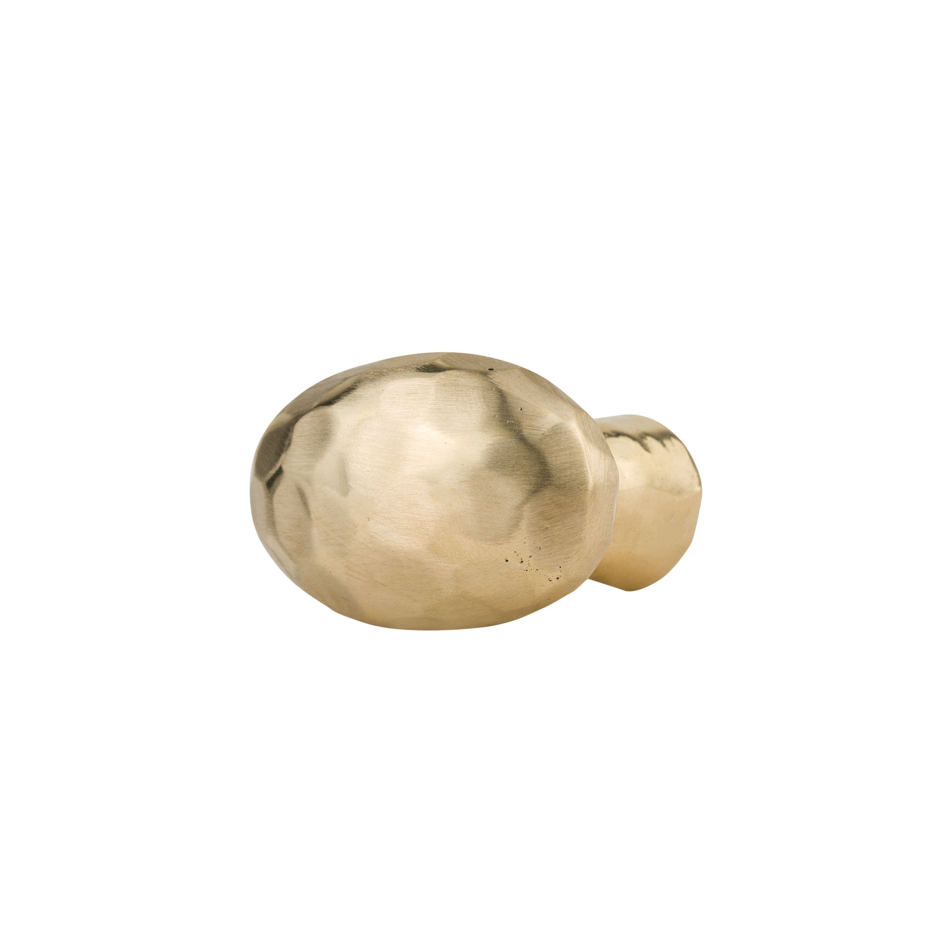 hammered oval brass cabinet knob on a white background
