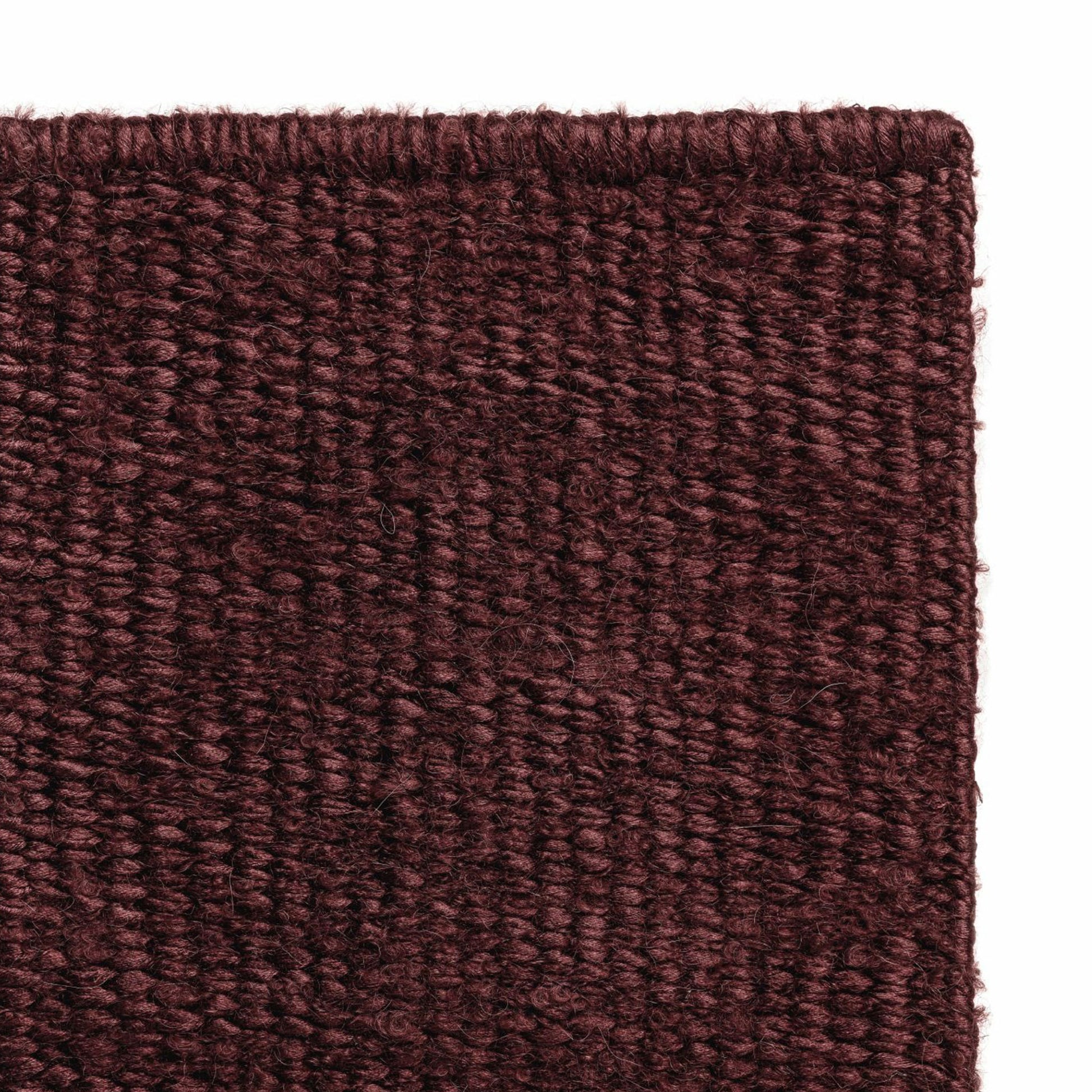 Luce rug style in garnet colored mottled twisted flat weave