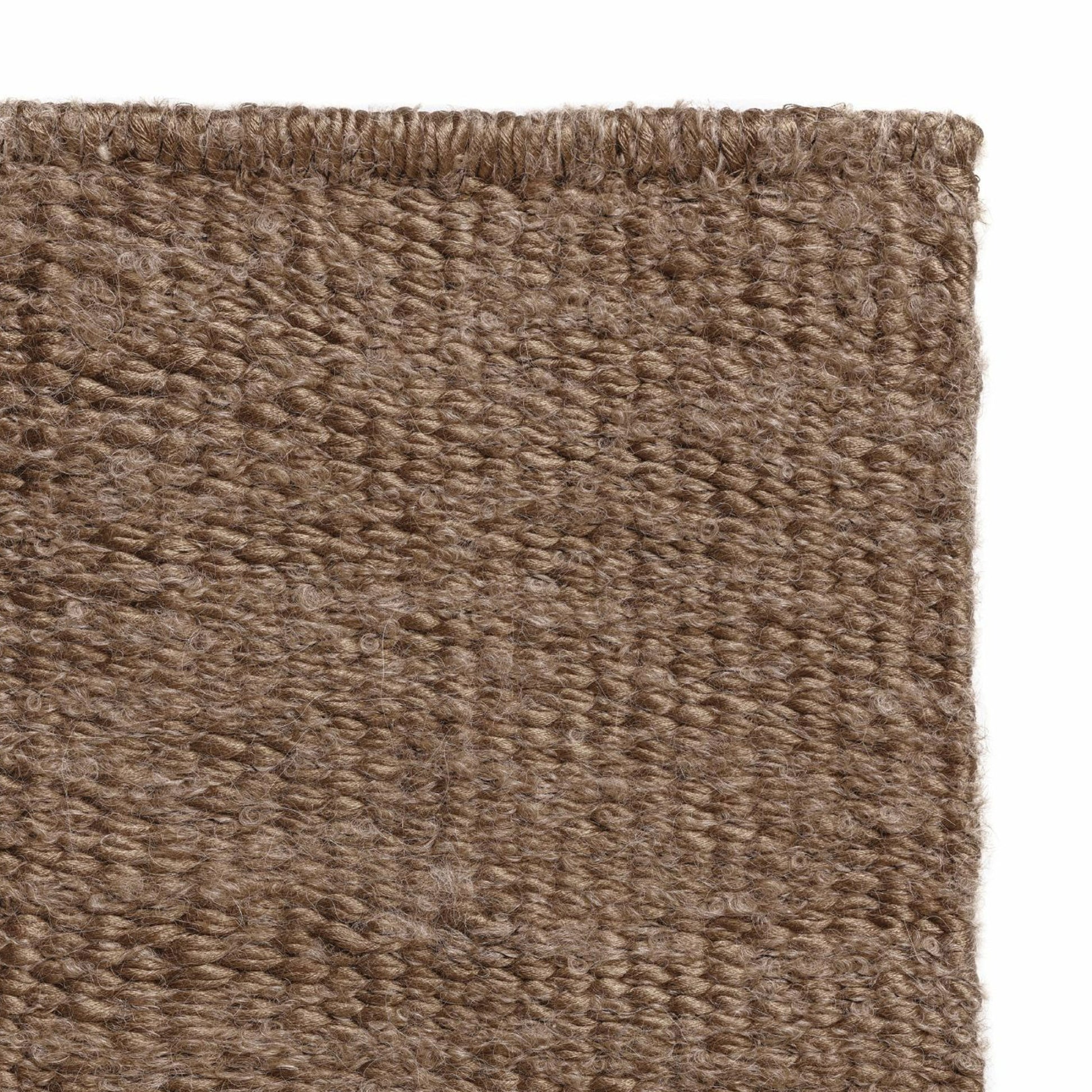 Luce rug style in terra cotta colored mottled twisted flat weave