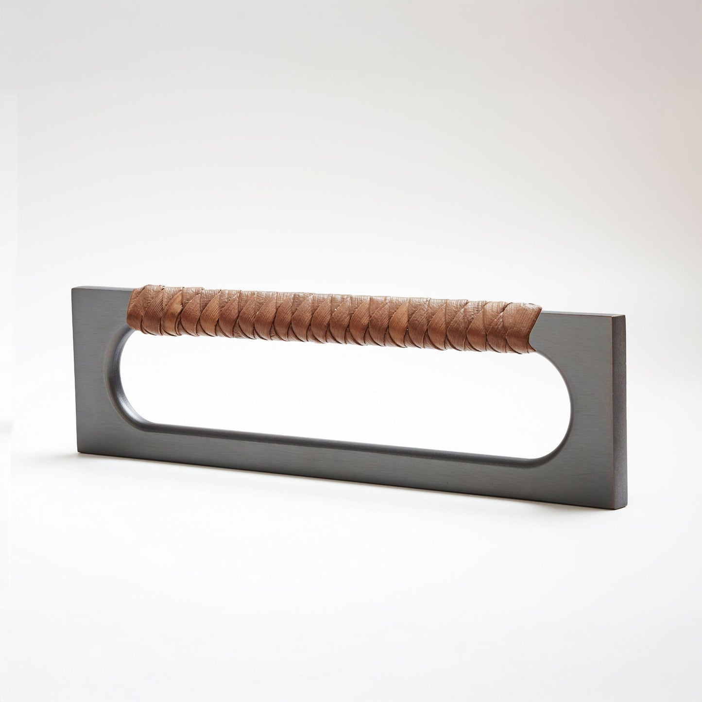 A modern long rectangular cabinet pull handle featuring a dark oil-rubbed bronze metal frame and a textured dark natural brown braided pine grip, shown on a white background.