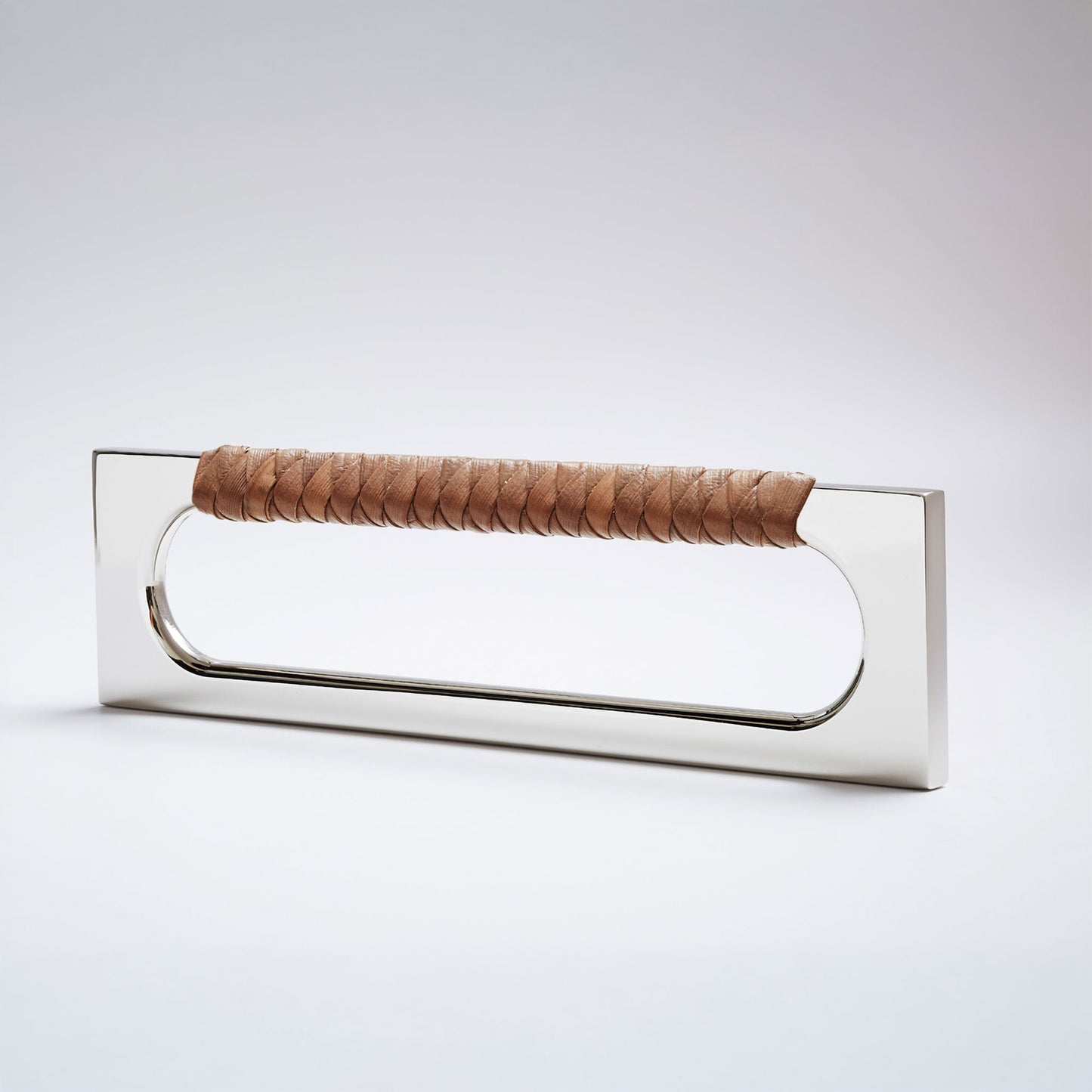 A modern long rectangular cabinet pull handle featuring a polished nickel metal frame and a textured brown braided pine grip, shown on a white background.