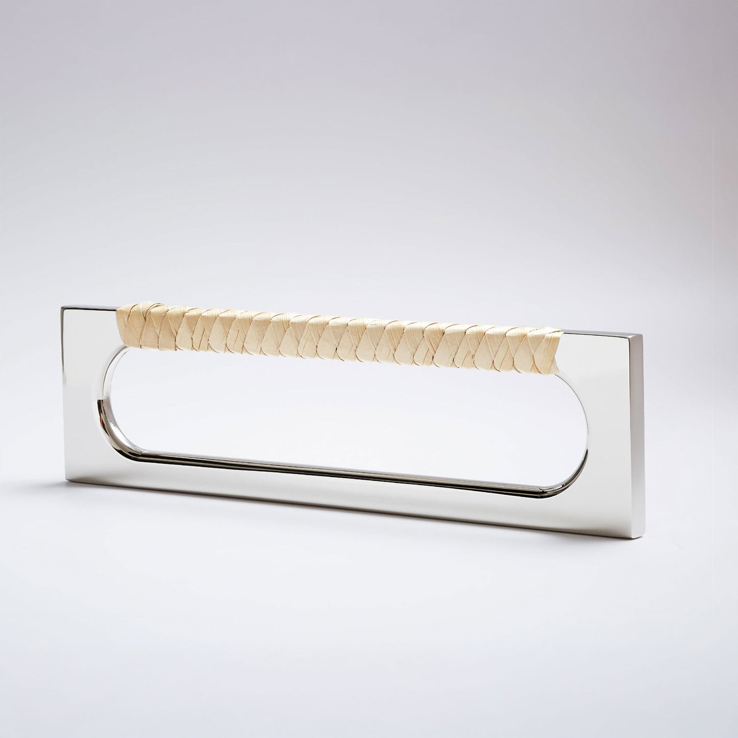 A modern long rectangular cabinet pull handle featuring a polished nickel metal frame and a textured light natural tan braided pine grip, shown on a white background.